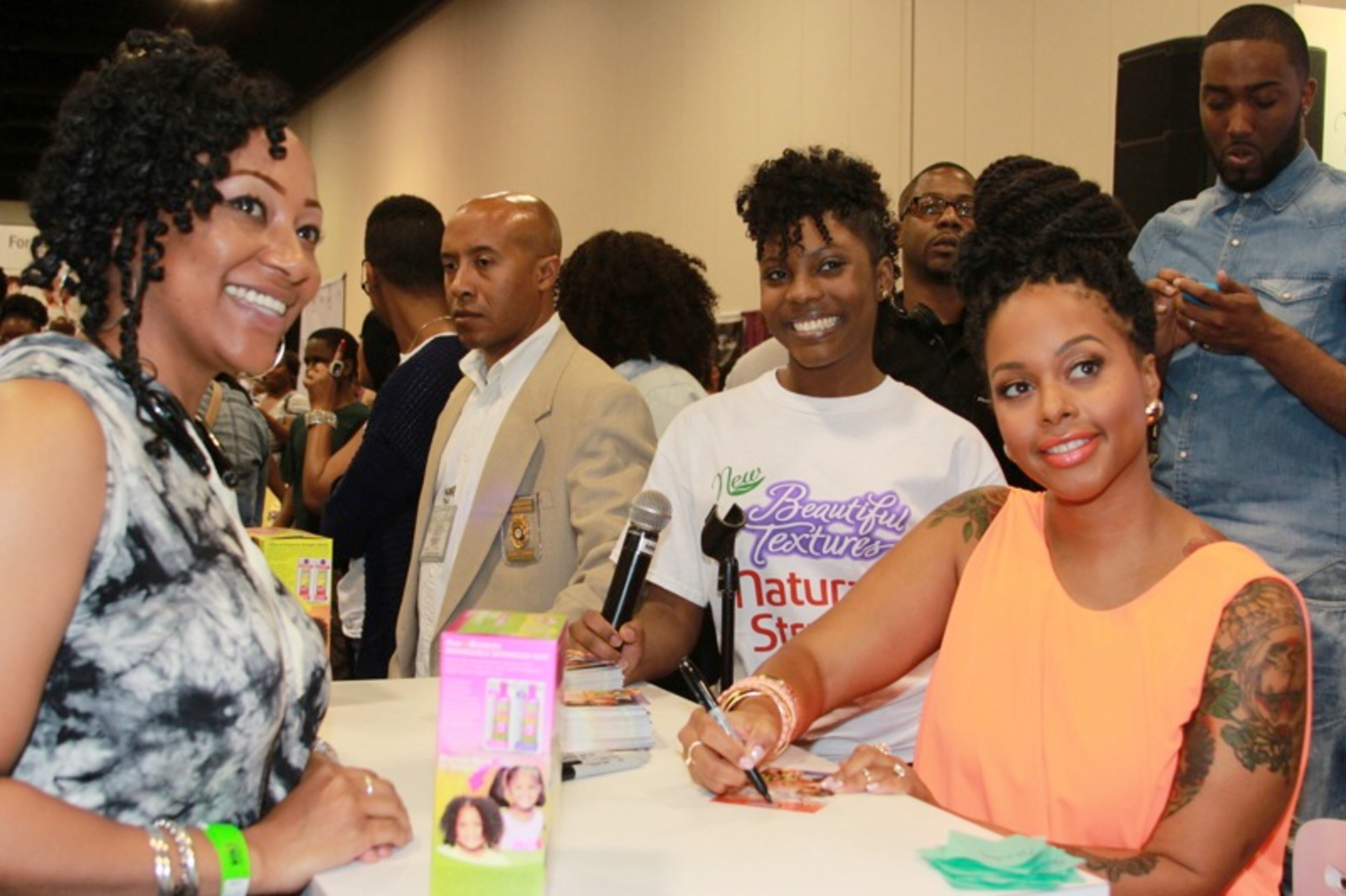 Chrisette Michele signs autographs and poses for pictures with her fans.