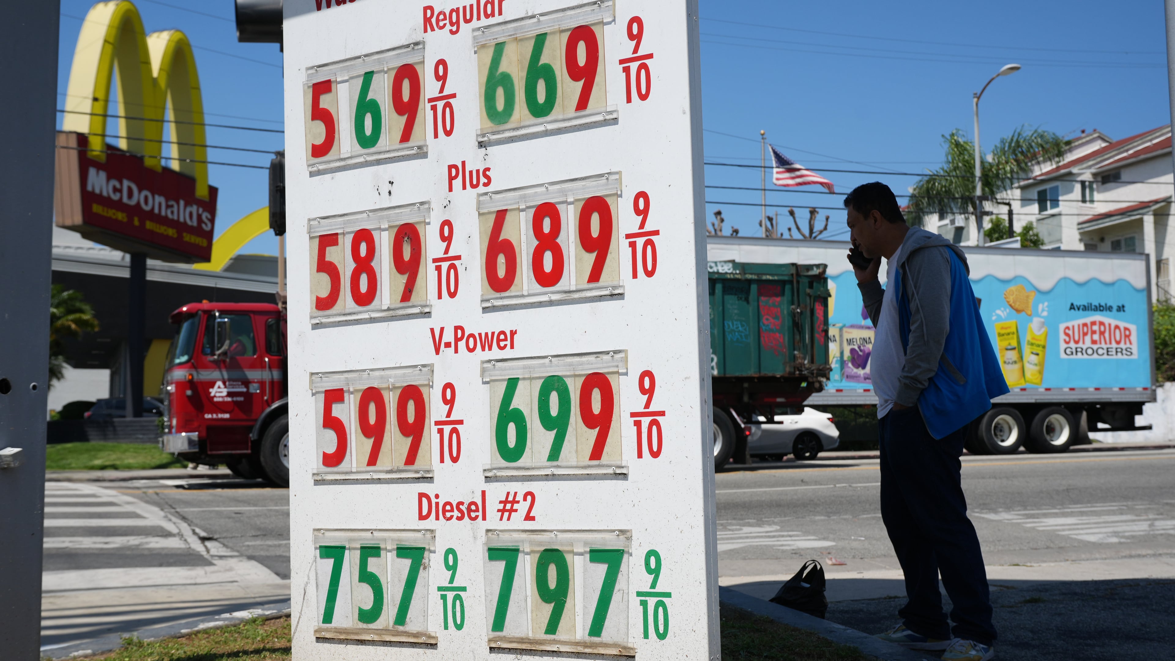 Gas prices are displayed at a gasoline station, Tuesday, April 7, 2026, in Los Angeles. (AP Photo/Damian Dovarganes)