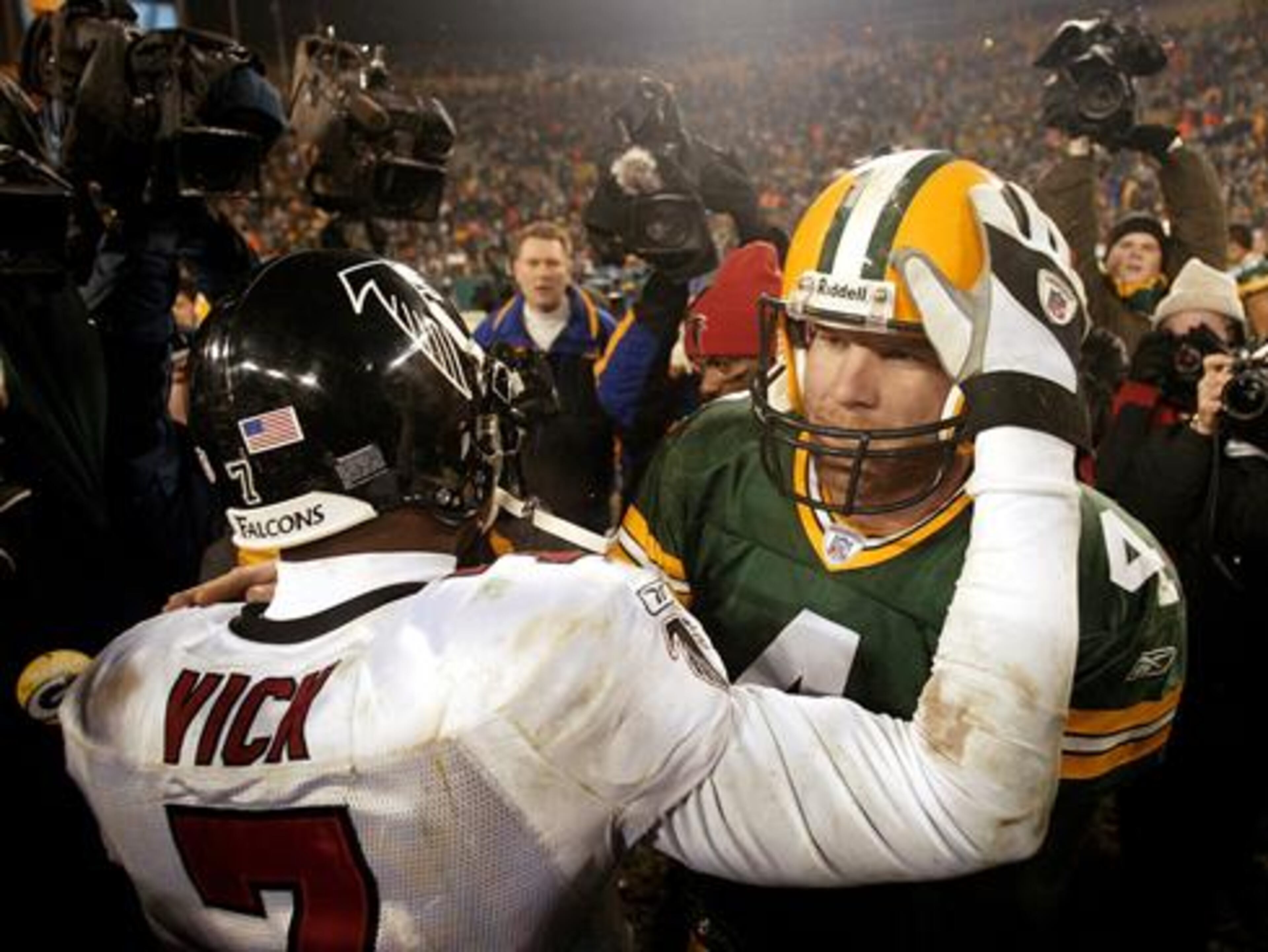 Falcons quarterback Michael Vick and Packers quarterback Brett Favre after Atlanta's 2003 wildcard playoff win in Green Bay.