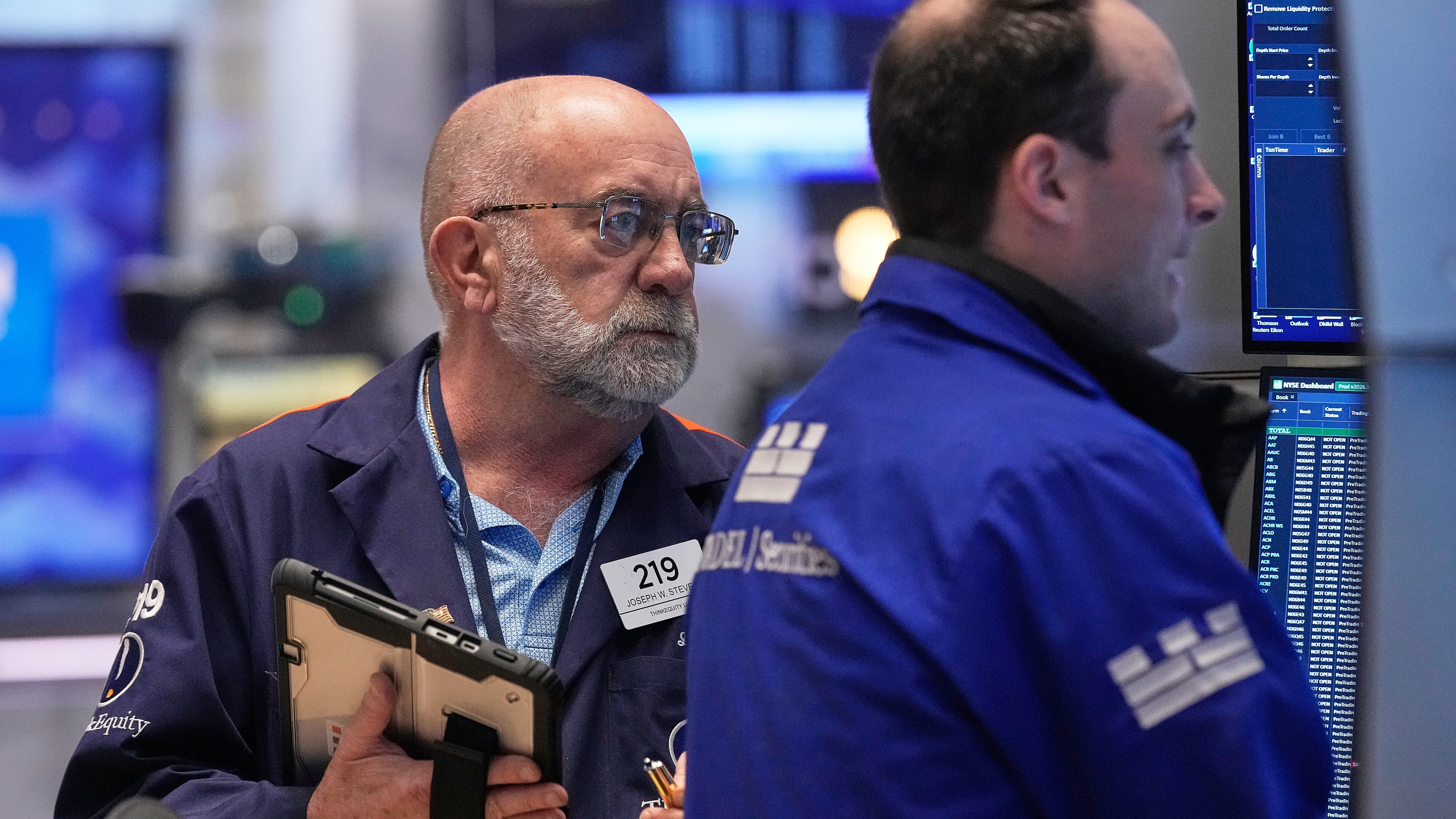 Trader Joseph Stevens, left, works on the floor of the New York Stock Exchange, Tuesday, May 5, 2026. (AP Photo/Richard Drew)
