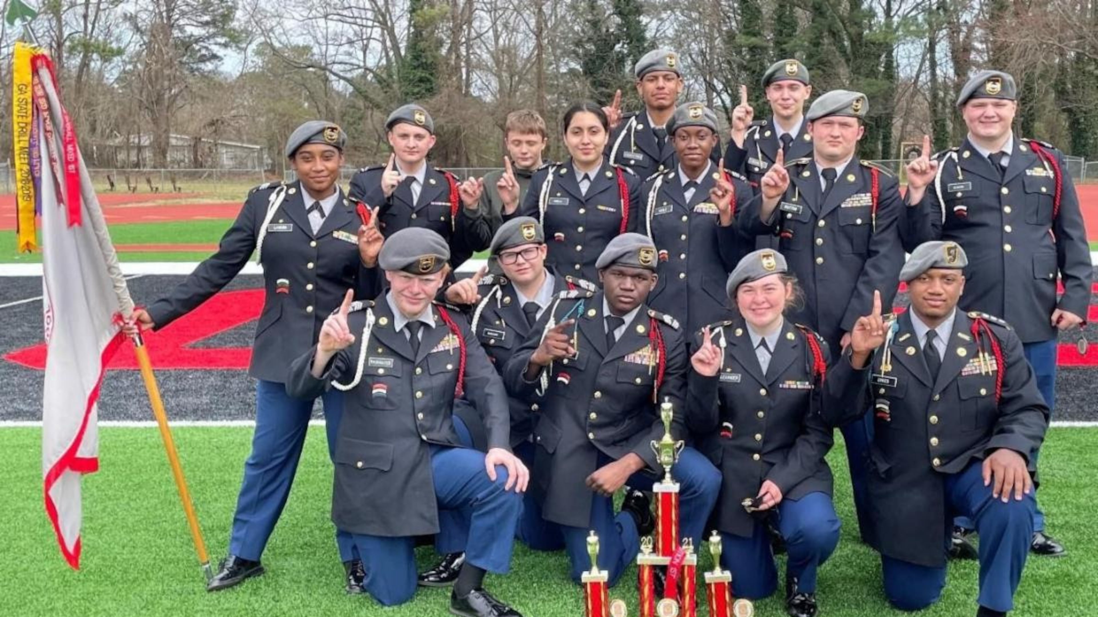 The Alexander Cougar Battalion Exhibition Team won 1st place in Squad Exhibition in the 2021 Regional Drill meet held March 6 at Osborne High School. Pictured: (Back row) David Griffith, Amari Lightford and John Eliott; (Middle row) Helen Laguna (holding guidon), Wesley Young, Danna Cabello, Brianna Gayle, Justin Dutton and Brian Blanton; (Front row) Kason Rainwater, Aiden McCleary, Alvarez Cowins, Haley Alexander and Aleczander Sykes