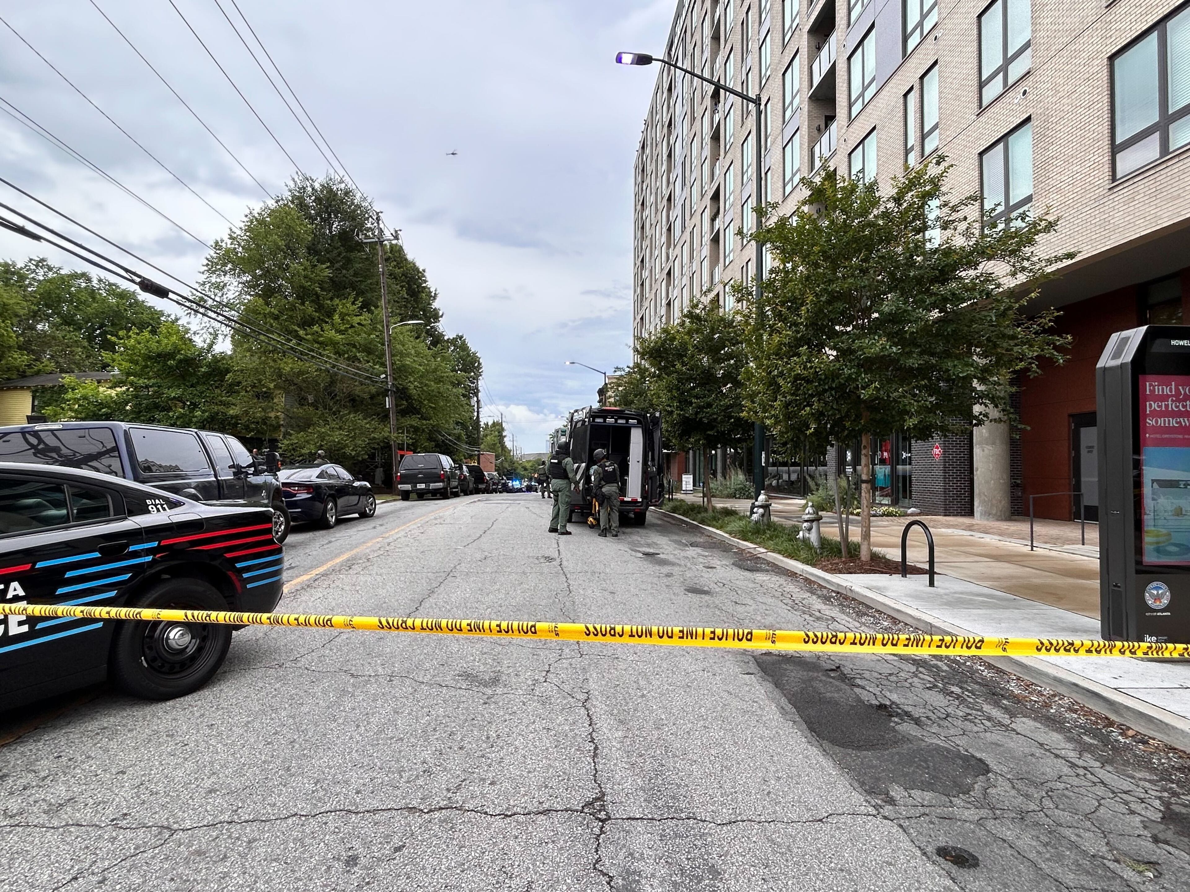 Atlanta police search for a shooting suspect in the area of the Brady apartments in West Midtown.