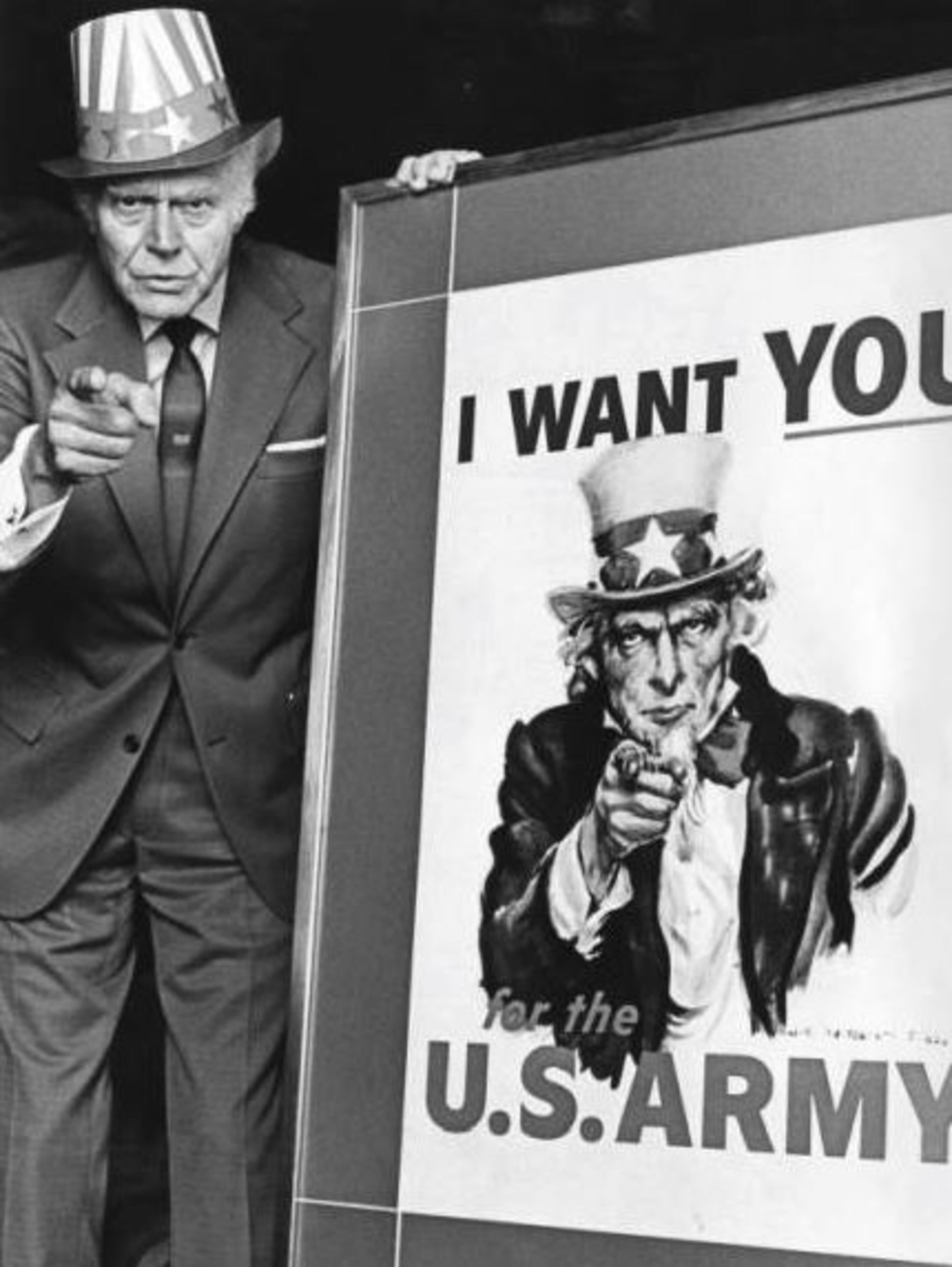 1971 -- Walter Botts strikes his Uncle Sam pose during a visit to Atlanta. In 1938, artist James Montgomery Flagg was drawing an Army recruiting poster, and he asked Botts, a musician, to pose as Uncle Sam. 'What do you want to do with your hands?' asked Flagg. 'Why don't I point my finger like this and say, 'I Want You?' Botts suggested, cupping his lips as he pronounced 'you.' 'No. Frown,' said Flagg. The result was the familiar poster that invited young men into the Army during World War II and for years afterwards. BILL GRIMES / AJC PHOTO ARCHIVES
