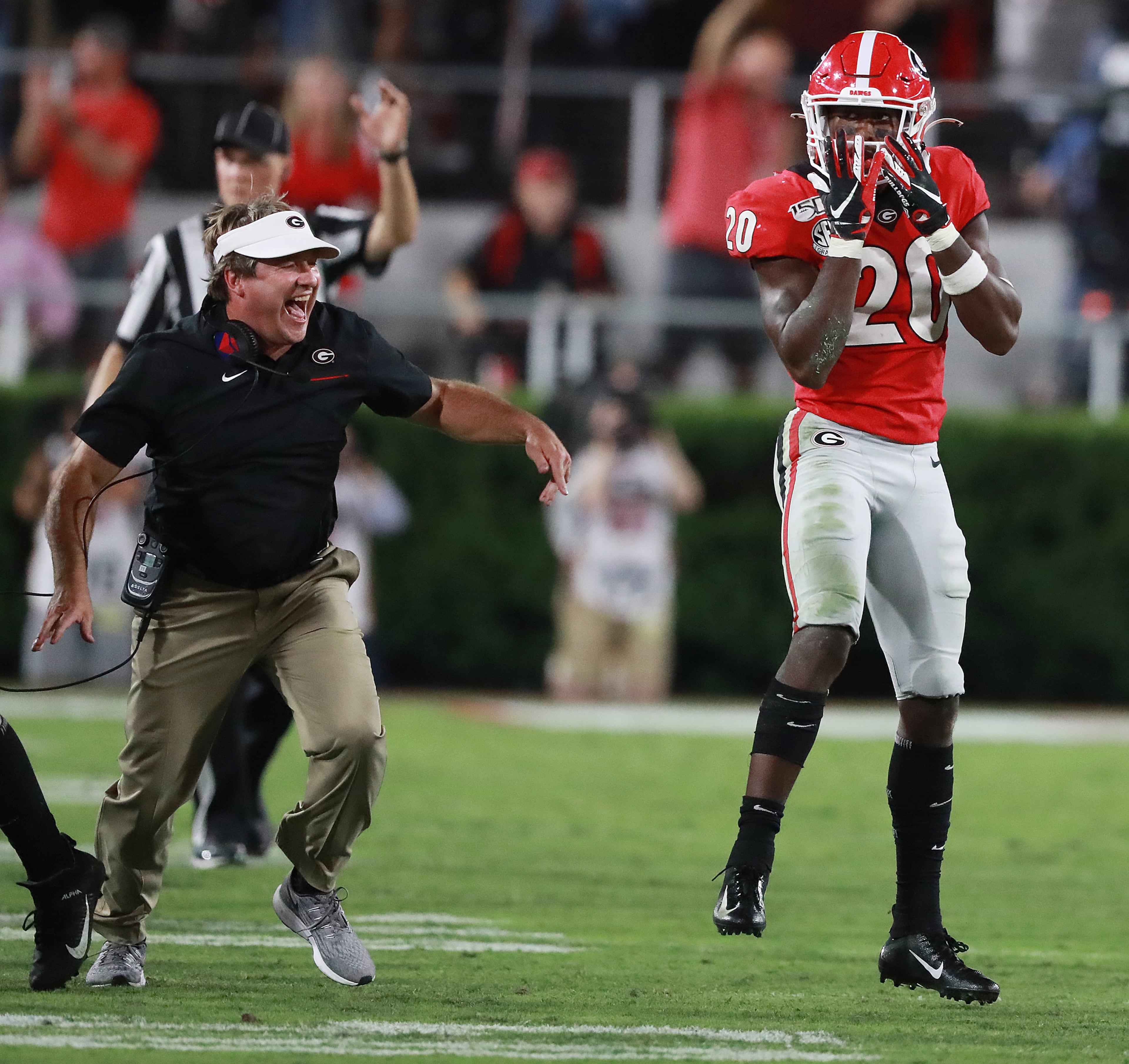 Georgia head coach Kirby Smart celebrates after defensive back J.R. Reed (right) intercepts Notre Dame quarterback Ian Book during the fourth quarter in a NCAA college football game on Saturday, Sept. 21, 2019, in Athens. Curtis Compton/ccompton@ajc.com