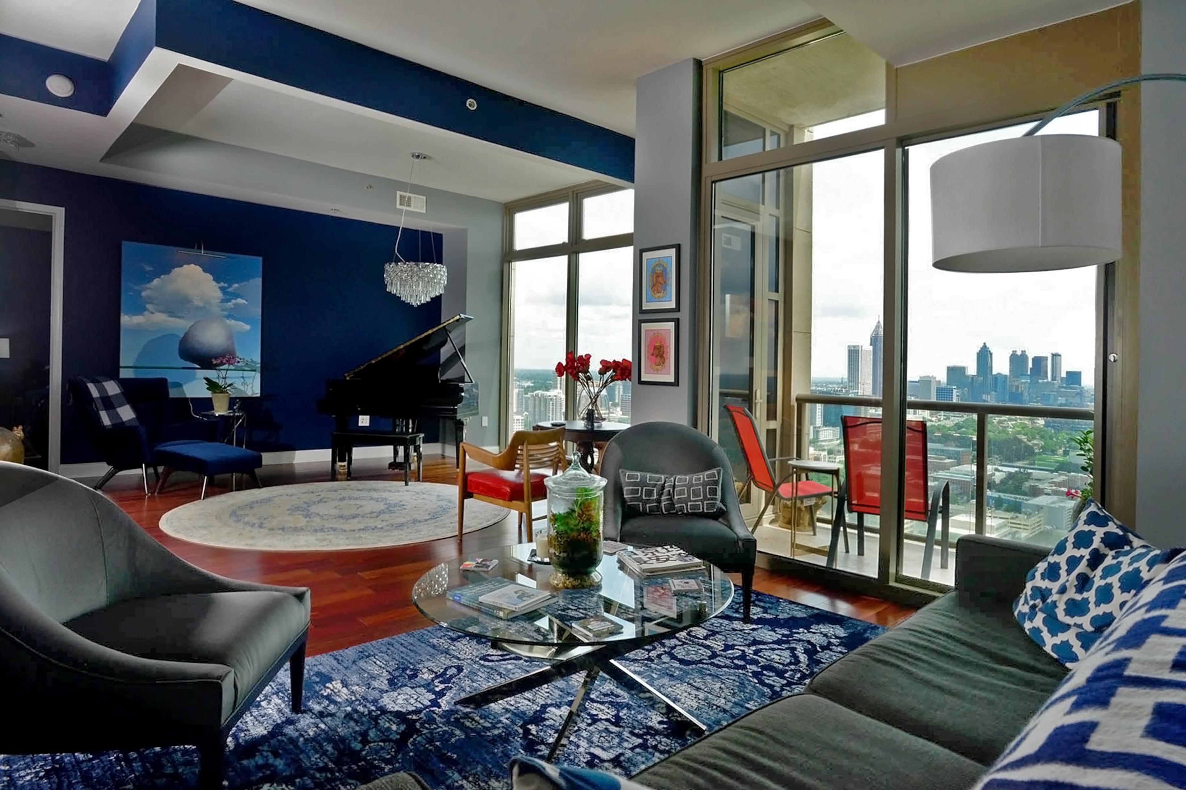 The homeowners removed a third bedroom to fully embrace the city scene from the living area in their modern condo in Midtown's Atlantic Station.