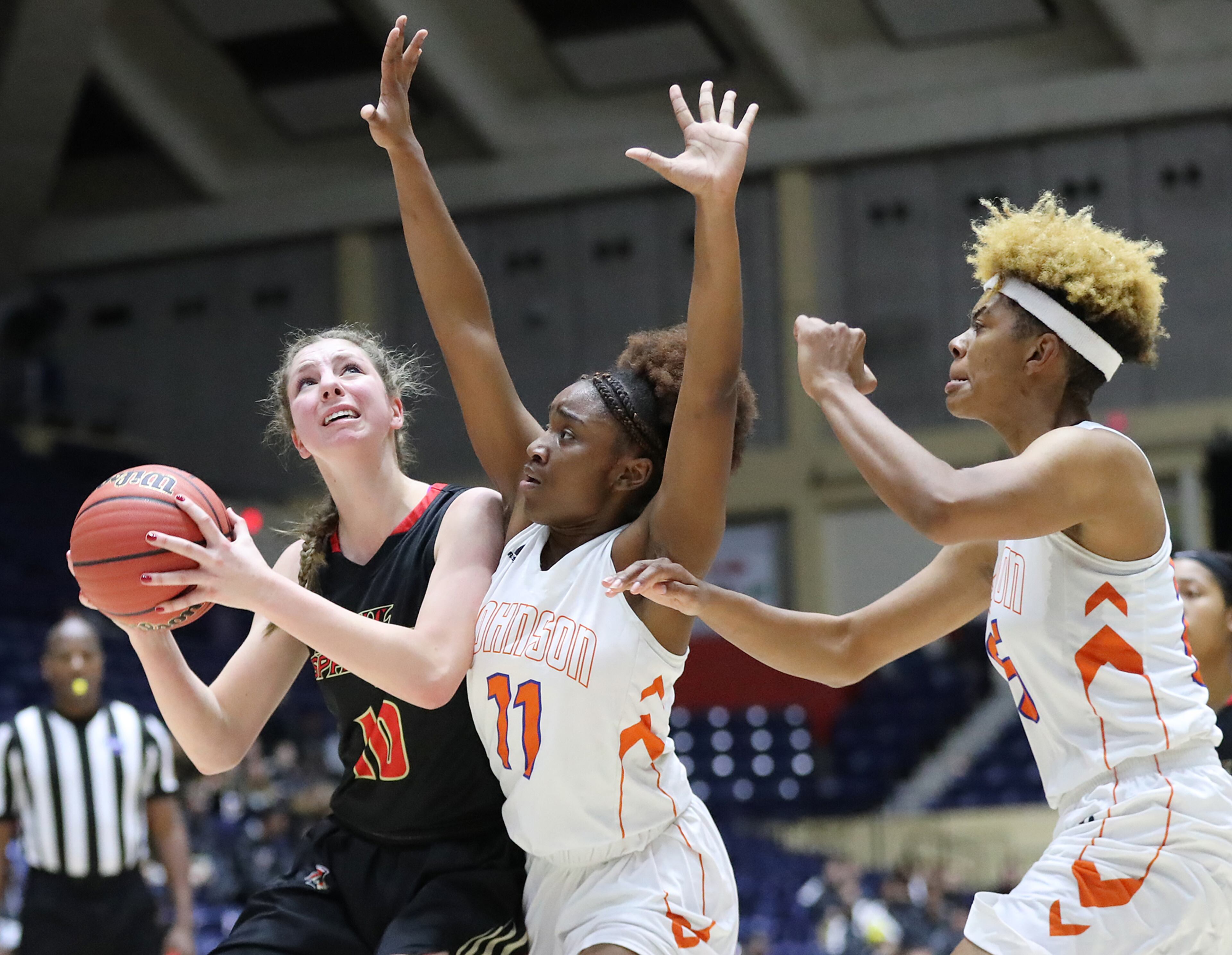 March 8, 2018 Macon: GAC center MaryMartha Turner is double teamed by Johnson-Savannah guard Jasmine Thompson and center Giana Copeland in their GHSA state basketball championship game on Thursday, March 8, 2018, in Macon. Curtis Compton/ccompton@ajc.com