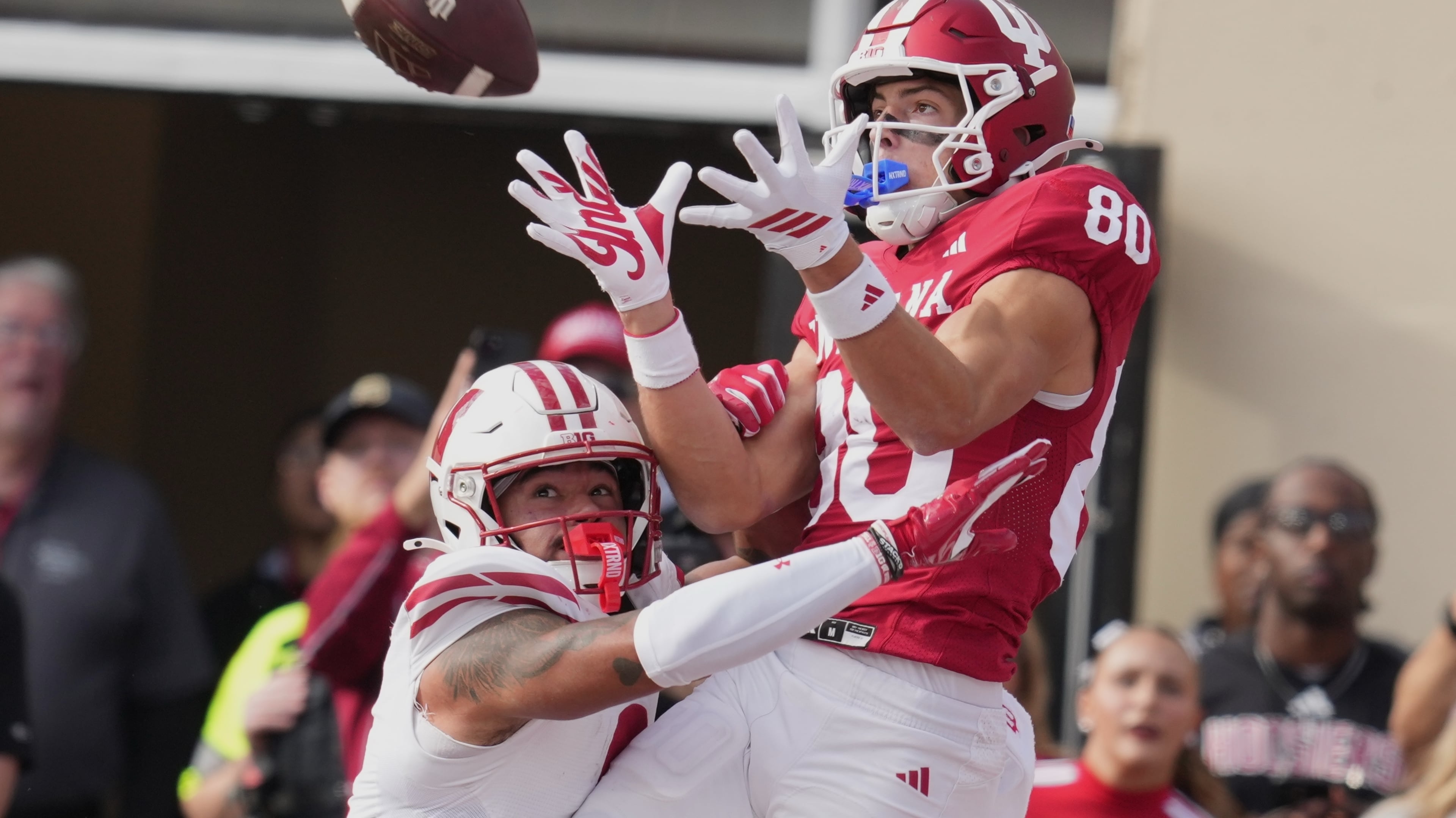 FILE - Indiana wide receiver Charlie Becker makes a touchdown catch over Wisconsin safety Austin Brown (9) during the first half of an NCAA college football game, Saturday, Nov. 15, 2025, in Bloomington, Ind. (AP Photo/Darron Cummings, file)
