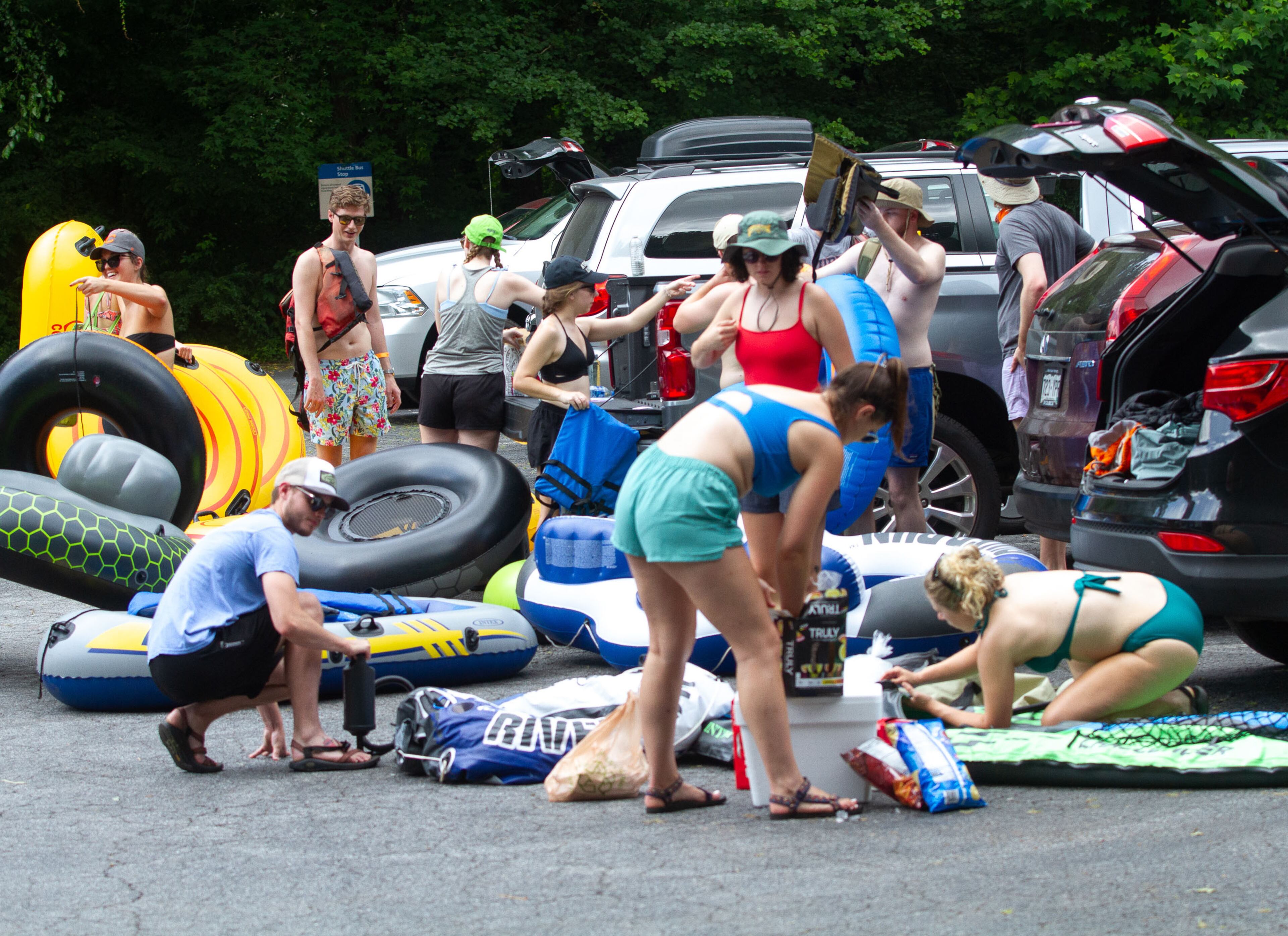People get there inner tubes ready before heading for the Chattahoochee River at Powers Island Park in Sandy Springs on Sunday, June 28, 2020. STEVE SCHAEFER FOR THE ATLANTA JOURNAL-CONSTITUTION