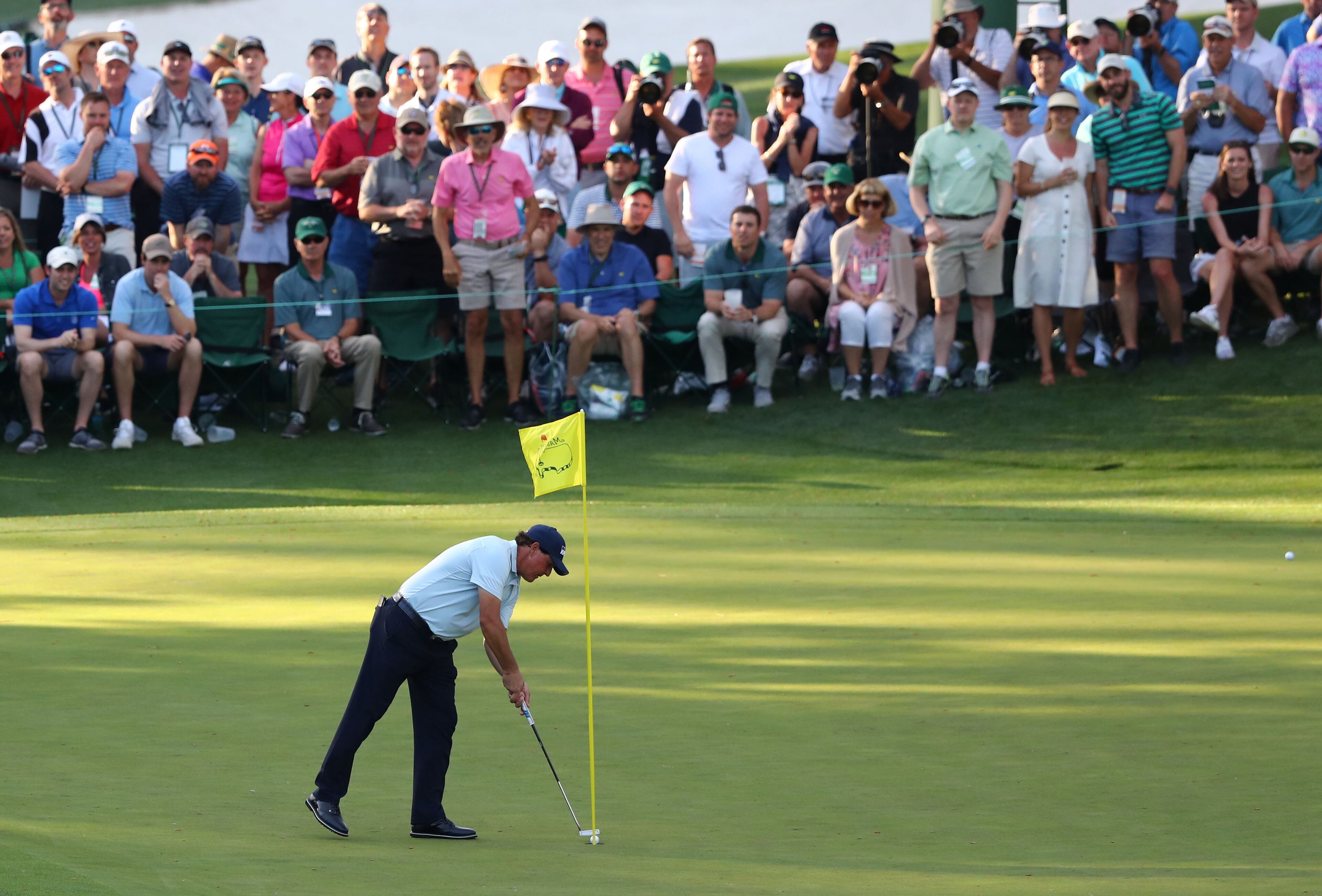 April 11, 2019 - Augusta - Phil Mickelson taps in a birdie put on 16 during the first round of the Masters Tournament Thursday, April 11, 2019, at Augusta National Golf Club in Augusta. Curtis Compton / ccompton@ajc.com