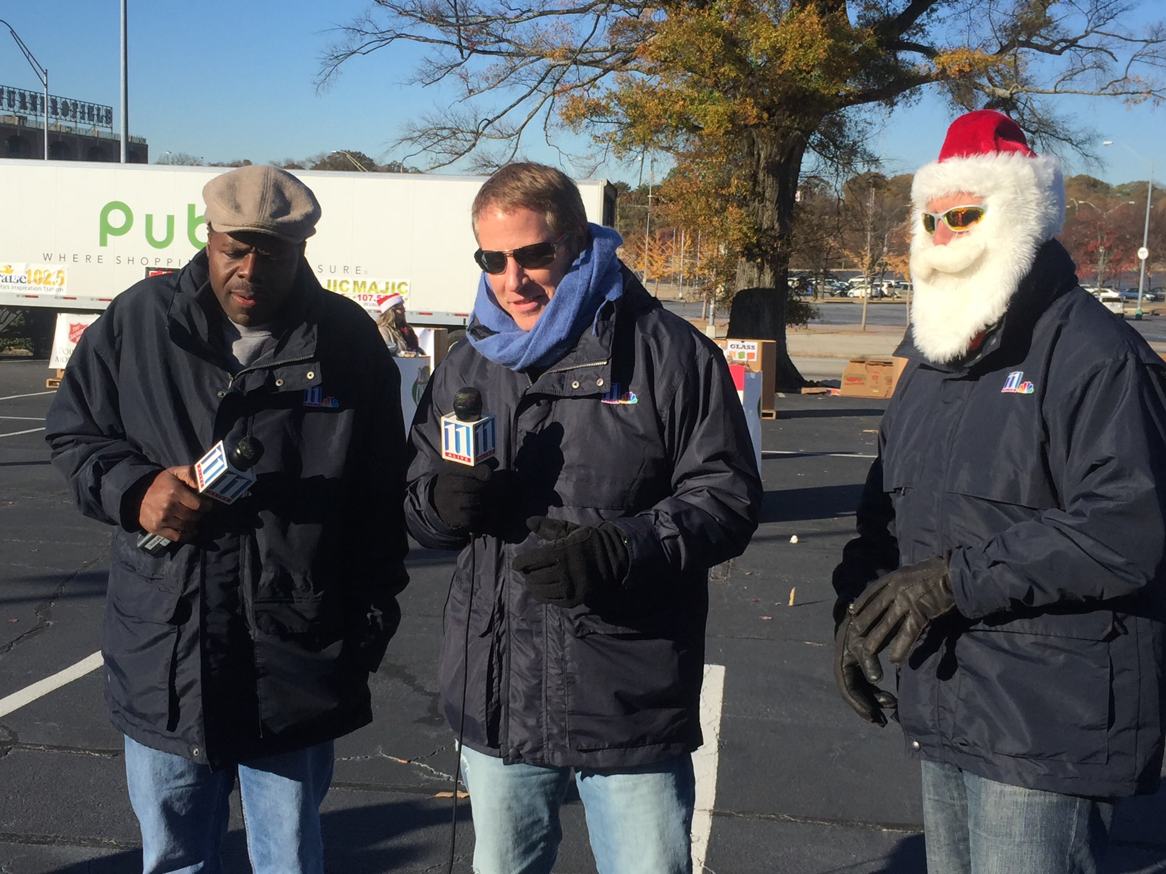 Chesley McNeil, Vinnie Politan and Chris "Crash" Clark in Santa gear at the 11Alive Can-a-thon at Turner Field. CREDIT: Rodney Ho/rho@ajc.com