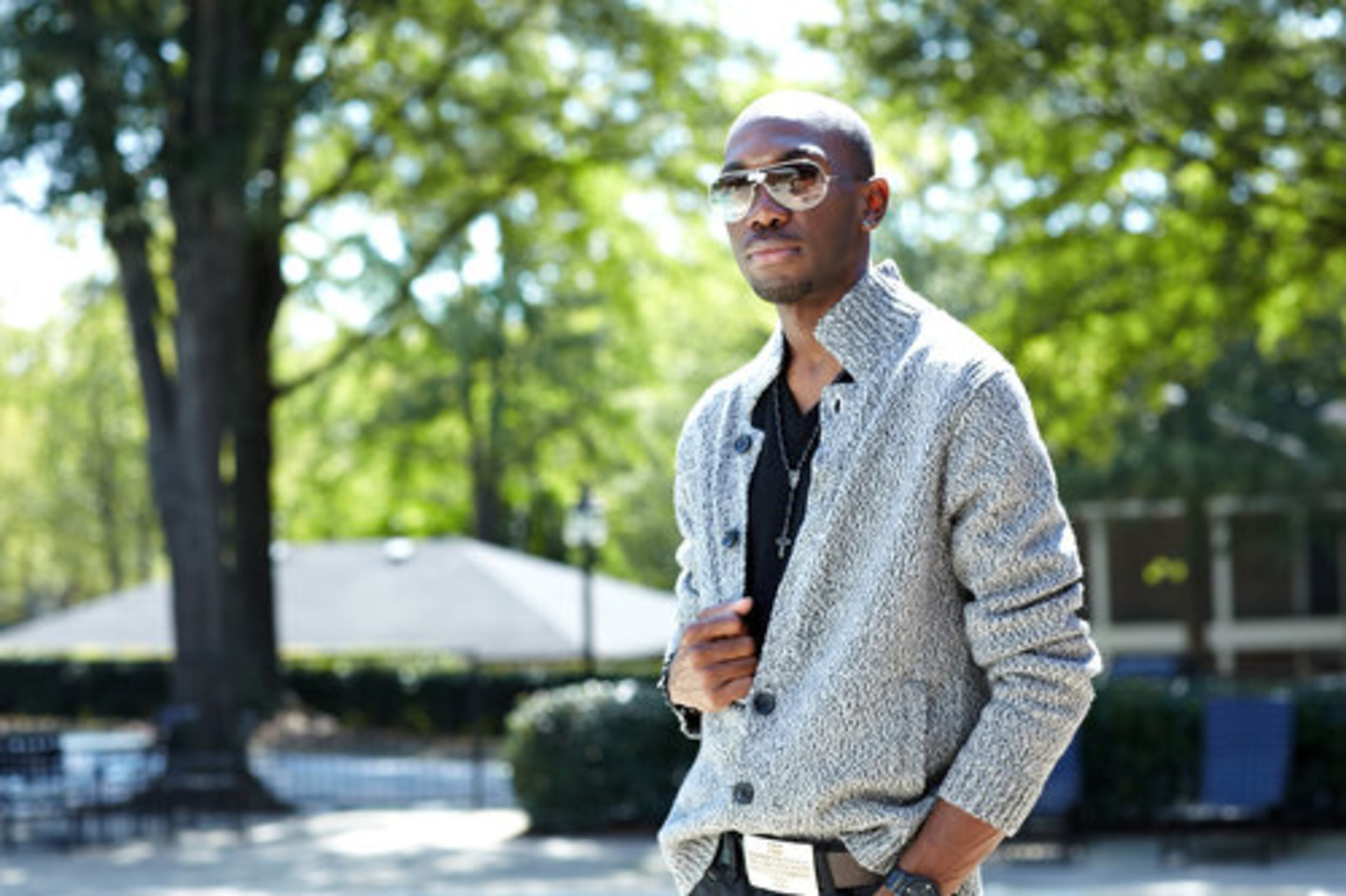 Harper shows off his Banana Republic cardigan that he pairs with a cashmere v-neck top from Kenneth Cole. Harper accessorizes with a belt from Buffalo jeans, Ray-Ban sunglasses and a rosary necklace from Guess.