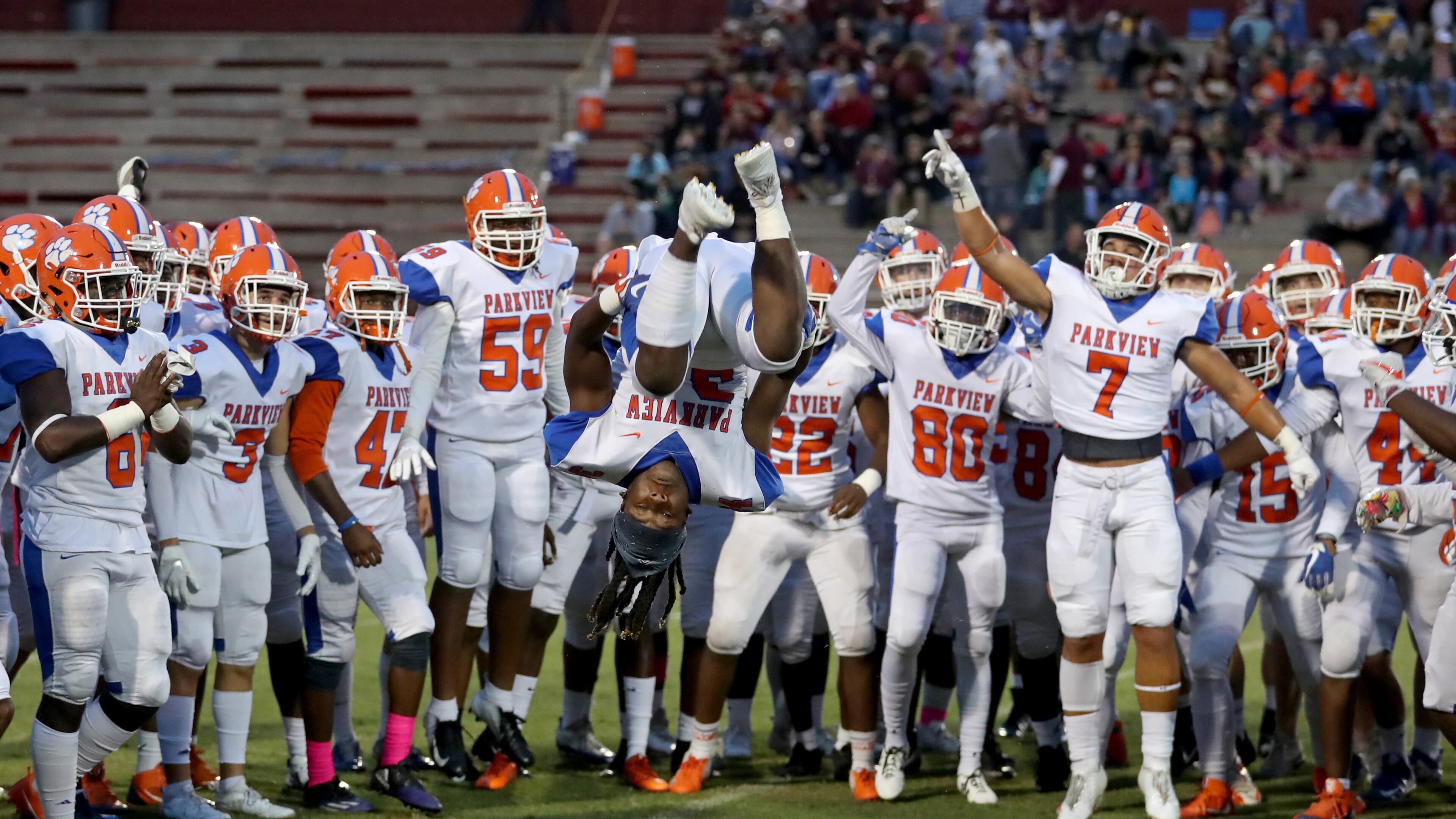 Parkview running back Gary Gamble (34) does a flip in front of his teammates before Friday's game. (Jason Getz/Special)