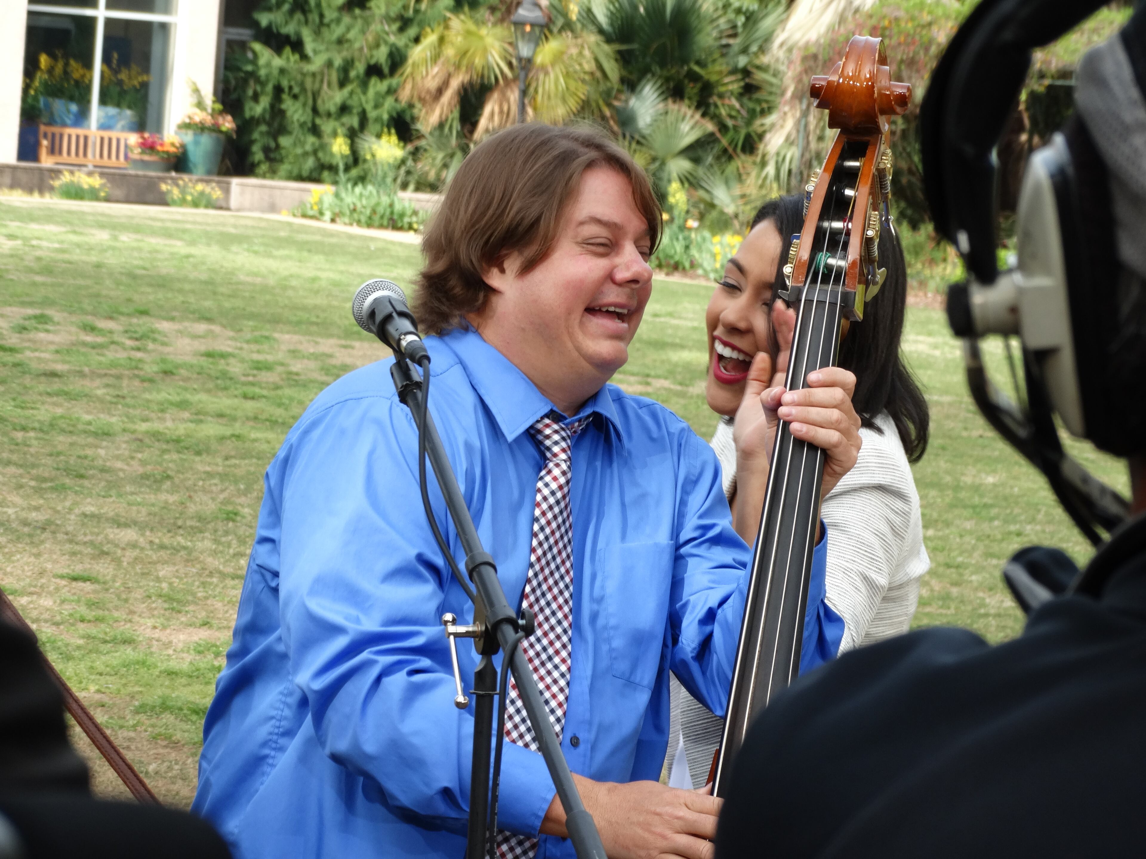 Jerry Roberts, the upright bass player for Smokey's Farmland Band, cavorts with Anaridis Rodriguez. CREDIT: Rodney Ho/rho@ajc.com