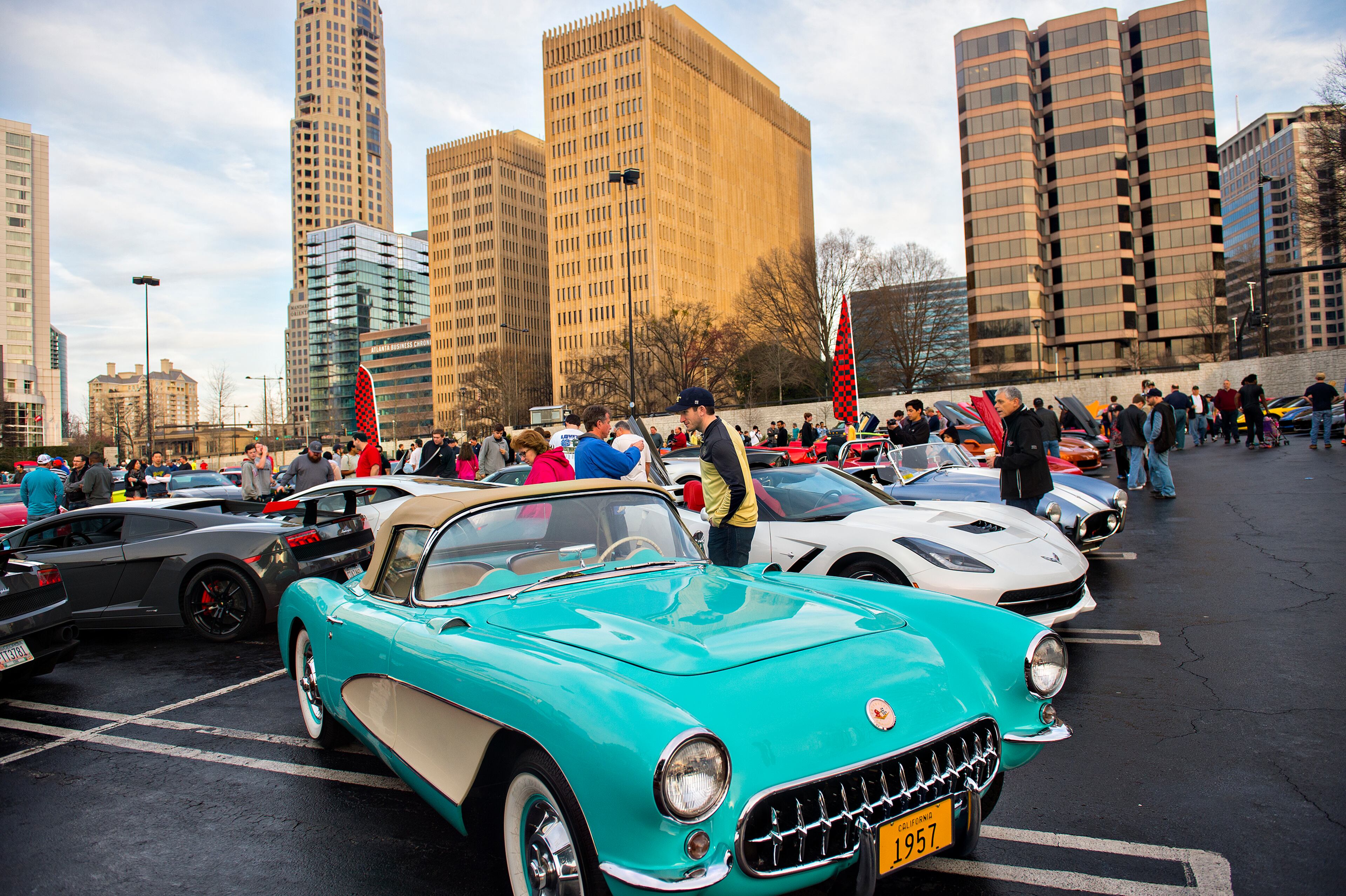 Justin Bruce (center) leans over to get a closer look at a Corvette. JONATHAN PHILLIPS / SPECIAL