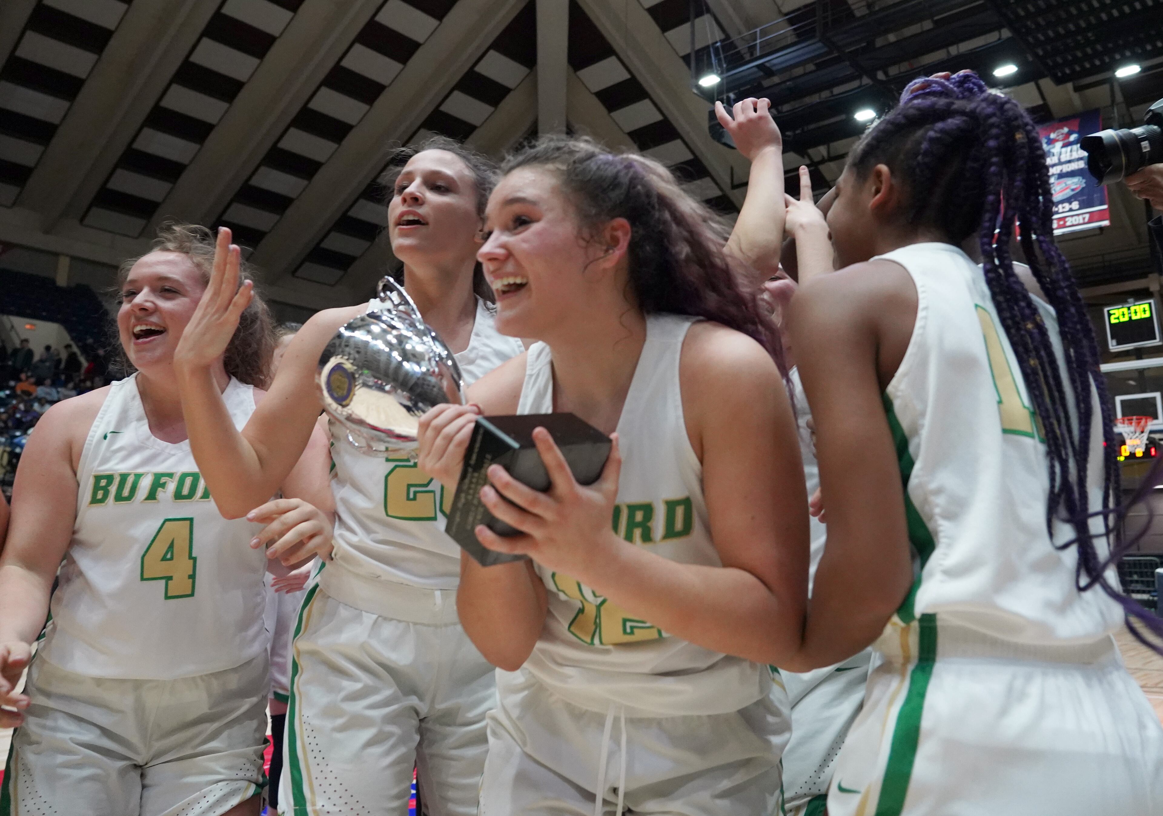 Buford High School players celebrate their win over Kell at the Class AAAA girls title basketball game at the Macon Centreplex, Friday March 6, 2020, in Macon. Tami Chappell for the Atlanta Journal Constitution