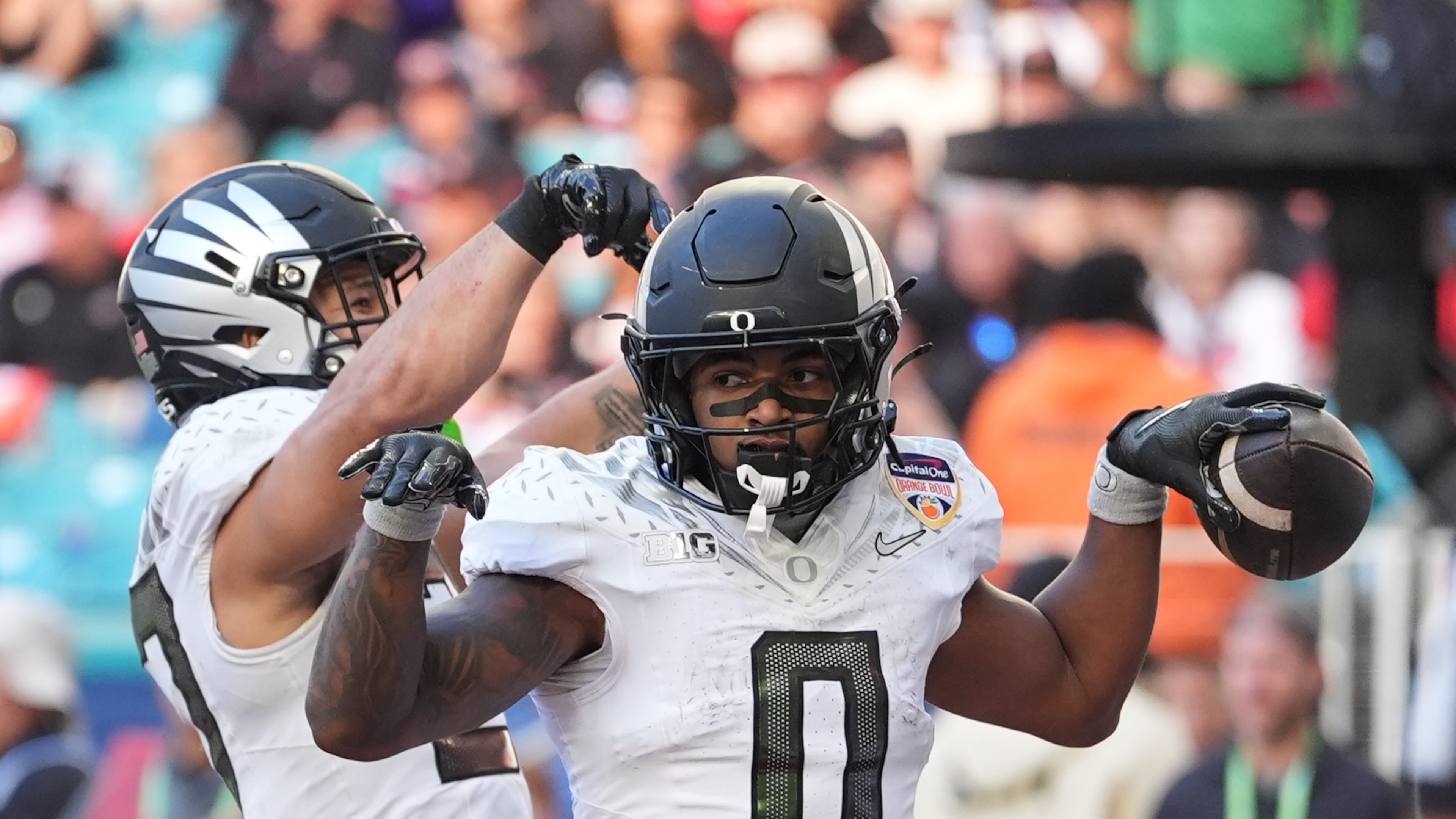 Oregon running back Jordon Davison celebrates a touchdown against Texas Tech during the second half of the Orange Bowl College Football Playoff quarterfinal game, Thursday, Jan. 1, 2026, in Miami Gardens, Fla. (AP Photo/Rebecca Blackwell)