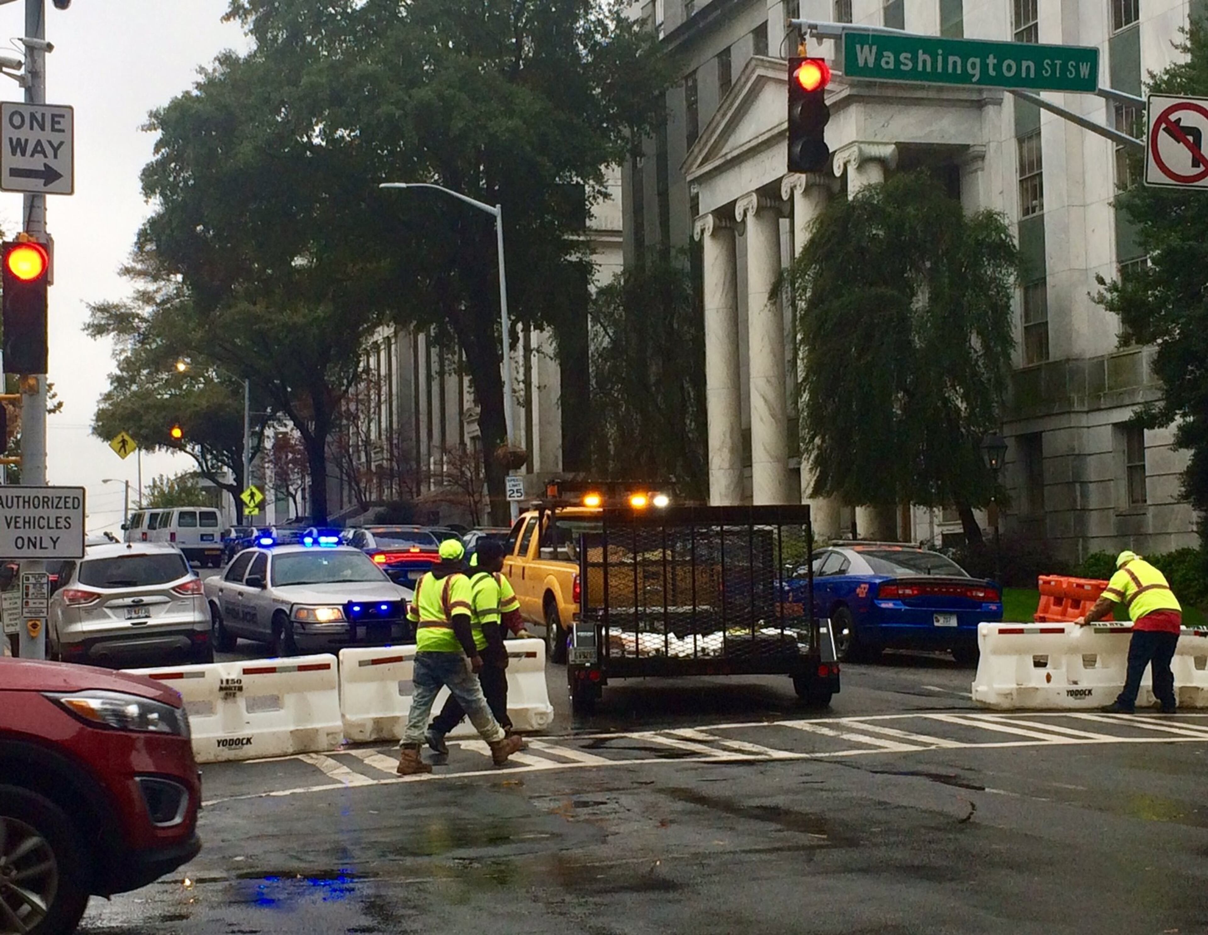 Georgia Department of Transportation crews work to close off Mitchell Street by the Capitol.