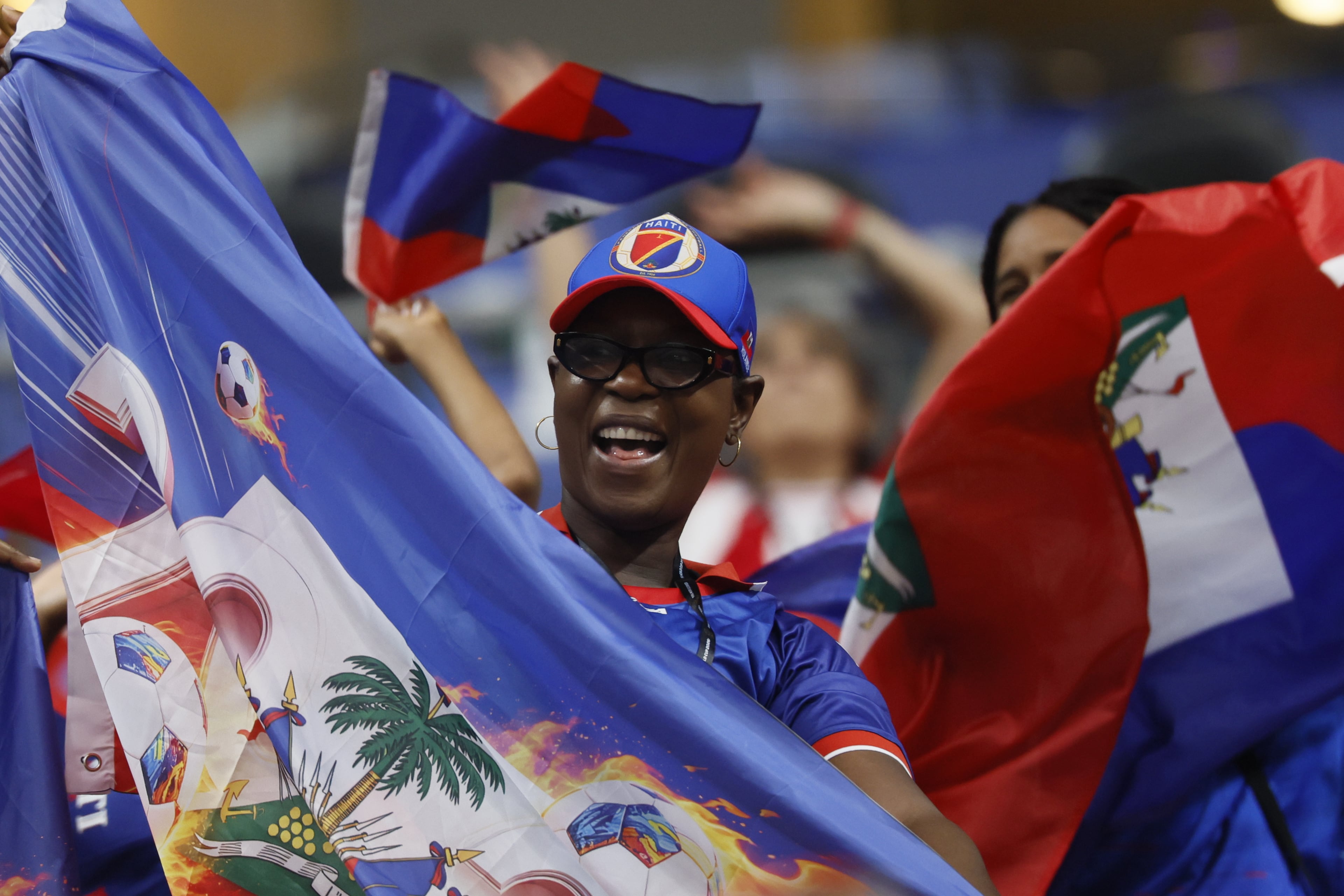 Haiti supporters cheer as their team enters the pitch for warm-ups before the start of the Morocco vs. Haiti Group C FIFA World Cup match at Atlanta Stadium (Mercedes-Benz Stadium) on Wednesday, June 24, 2026. (Miguel Martinez/AJC)