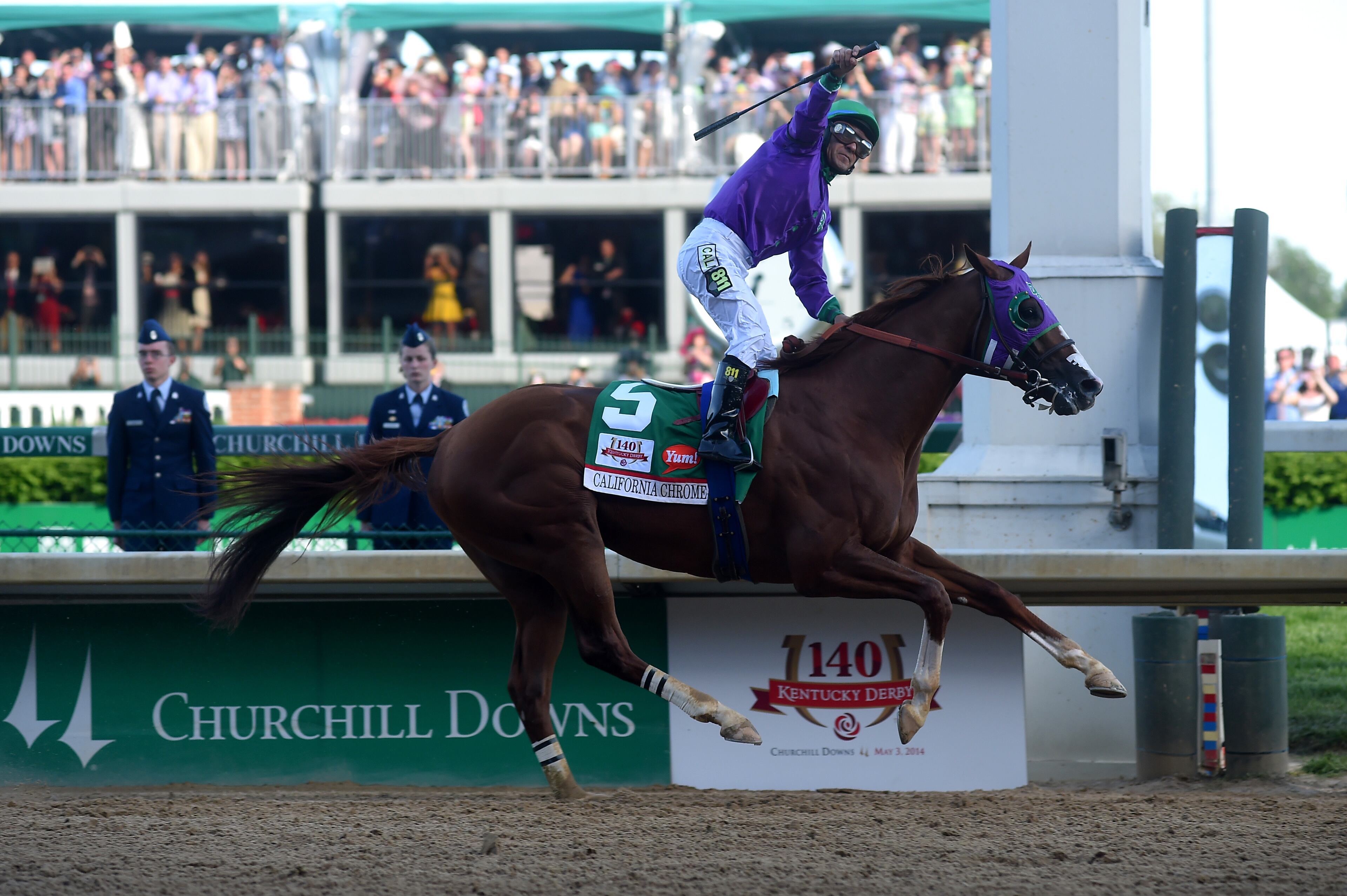 LOUISVILLE, KY - MAY 03: California Chrome #5, ridden by Victor Espinoza, crosses the finish line to win the 140th running of the Kentucky Derby at Churchill Downs on May 3, 2014 in Louisville, Kentucky. (Photo by Dylan Buell/Getty Images)