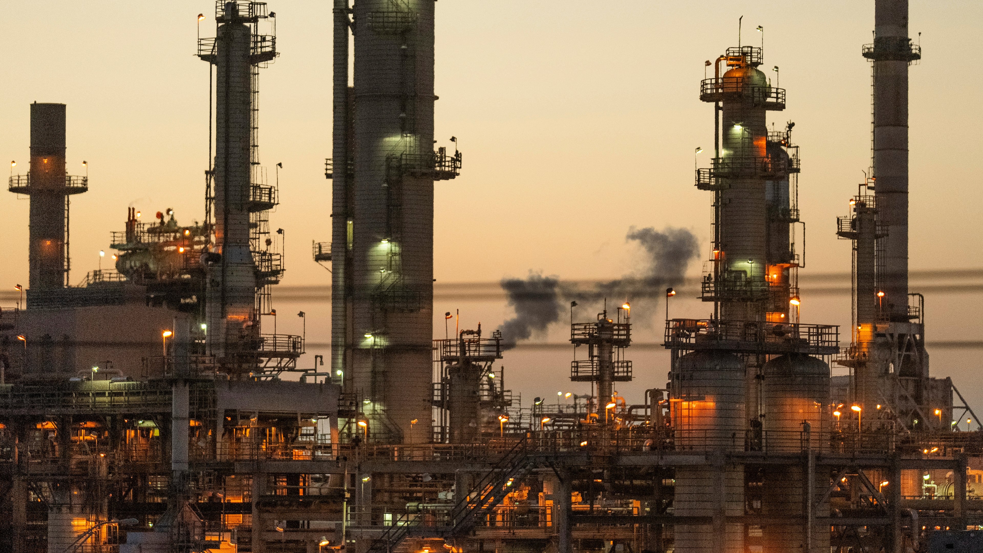 FILE - Lights illuminate an oil refinery in Carson, Calif., May 29, 2024. (AP Photo/Damian Dovarganes, File)