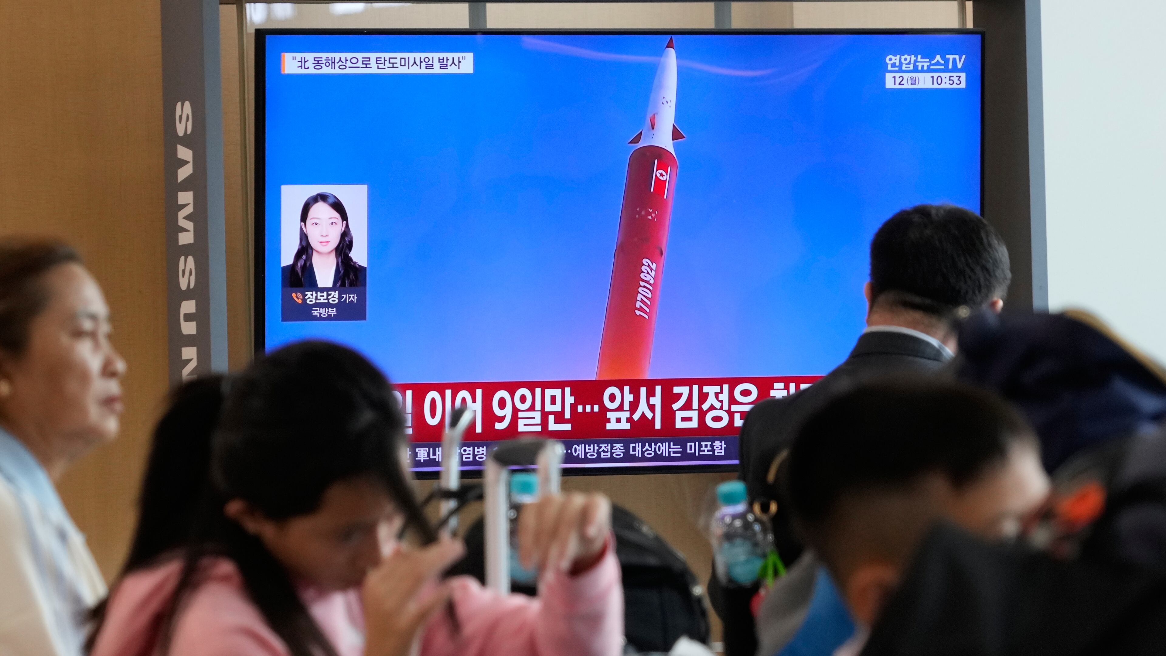 A TV screen shows a file image of a North Korean missile launch during a news program at Seoul Railway Station in Seoul, South Korea, Monday, Oct. 12, 2026. (AP Photo/Ahn Young-joon)