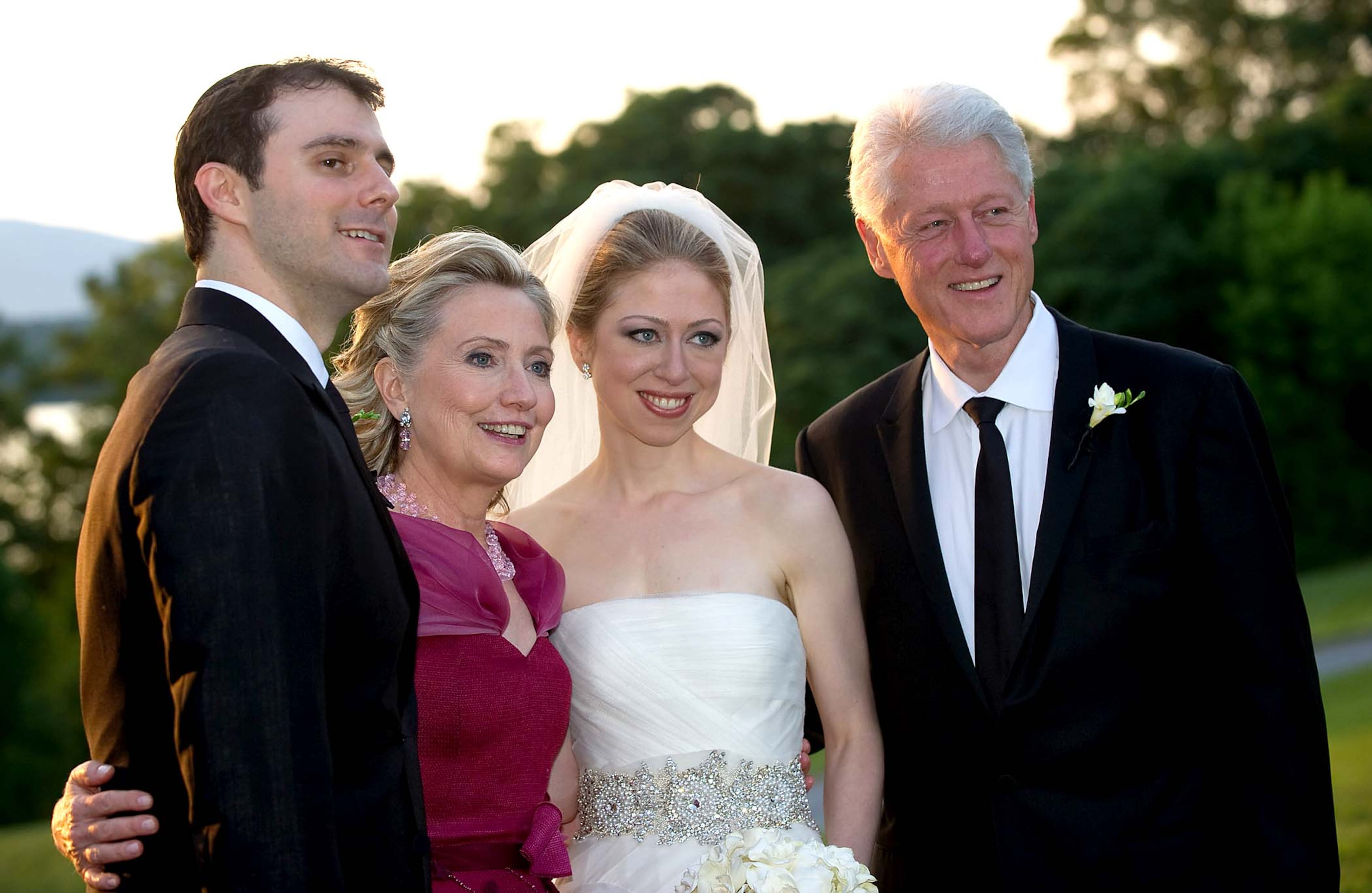 This photo released by Genevieve de Manio Photography shows Marc Mezvinsky,left with his new mother-in-law Hillary Rodham Clinton, his bride Chelsea and father-in-law former President Bill Clinton after the couple's wedding Saturday July 31, 2010 in Rhinebeck,N.Y. (Barbara Kinney/Genevieve de Manio Photography)