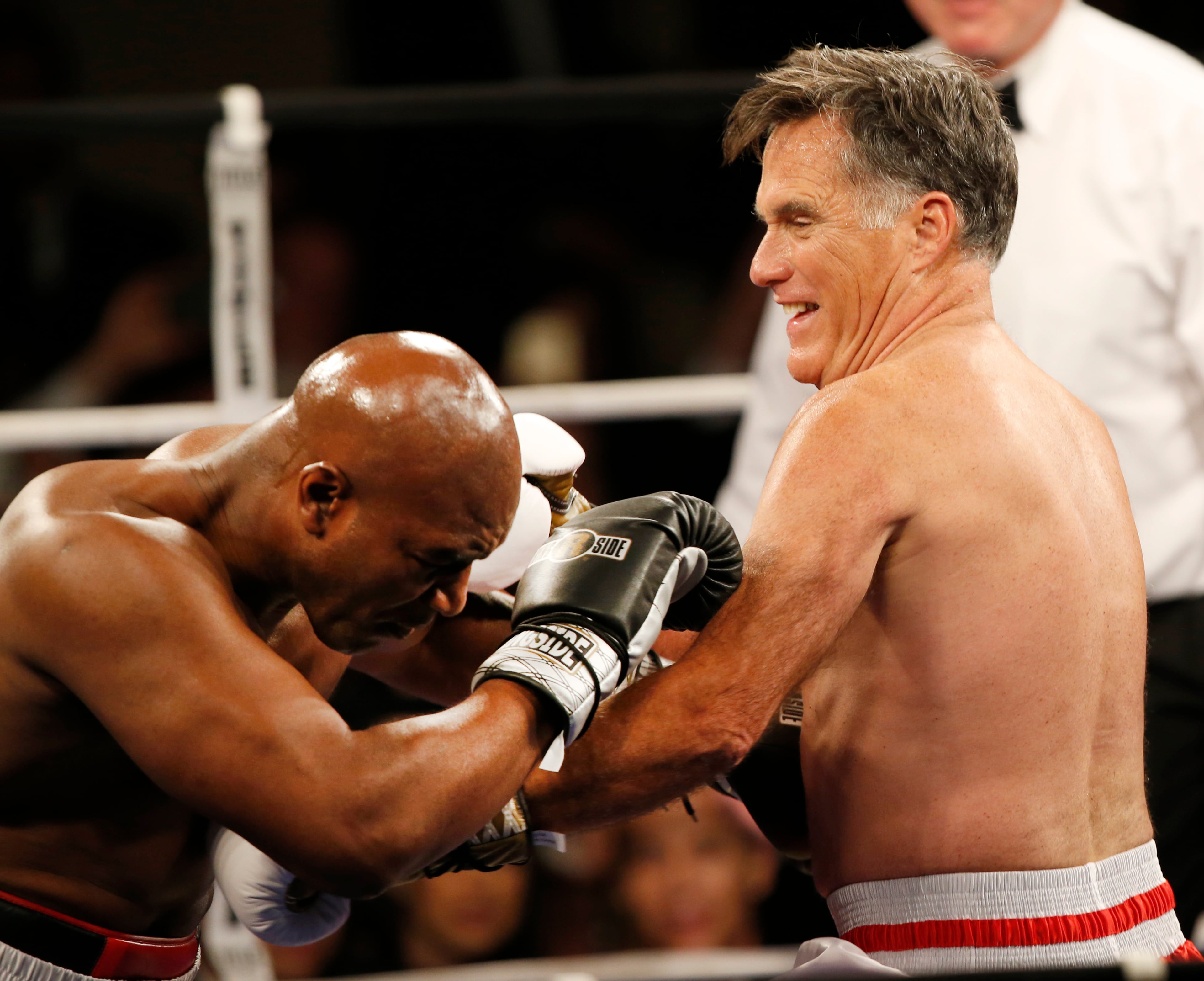 SALT LAKE CITY, UT - MAY 15: Mitt Romney and Evander Holyfield fight in a charity boxing event on May 15, 2015 in Salt Lake City, Utah. The event was held to raise money for "Charity Vision" a charity that aims to restore sight to the blind and visually impaired. (Photo by George Frey/Getty Images)