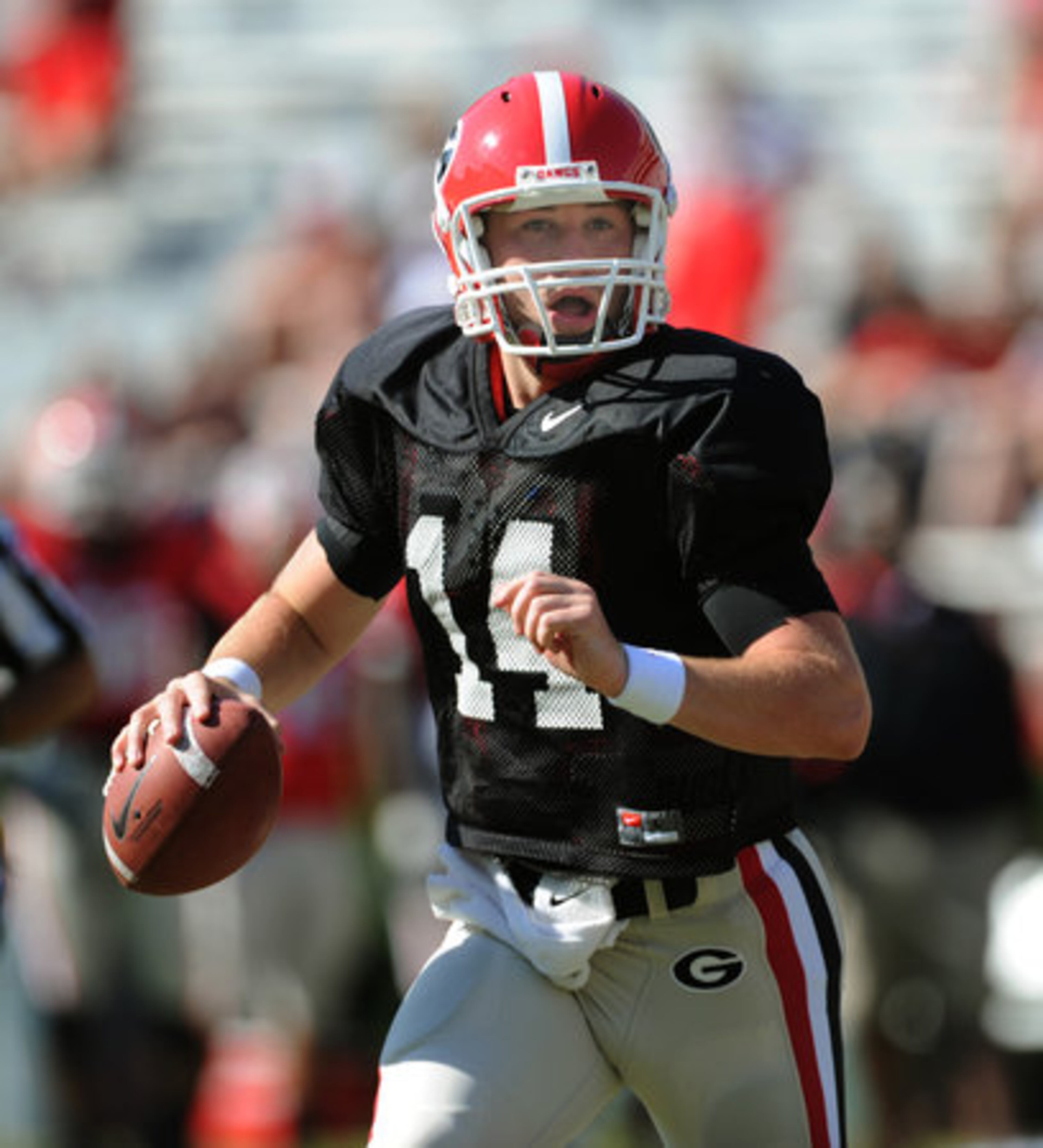 UGA quarterback Hutson Mason looks for an open receiver during the UGA Spring football Football Game in Sanford Stadium at the University of Georgia on Saturday, April 14,2012. The Red team won 32 to 31.