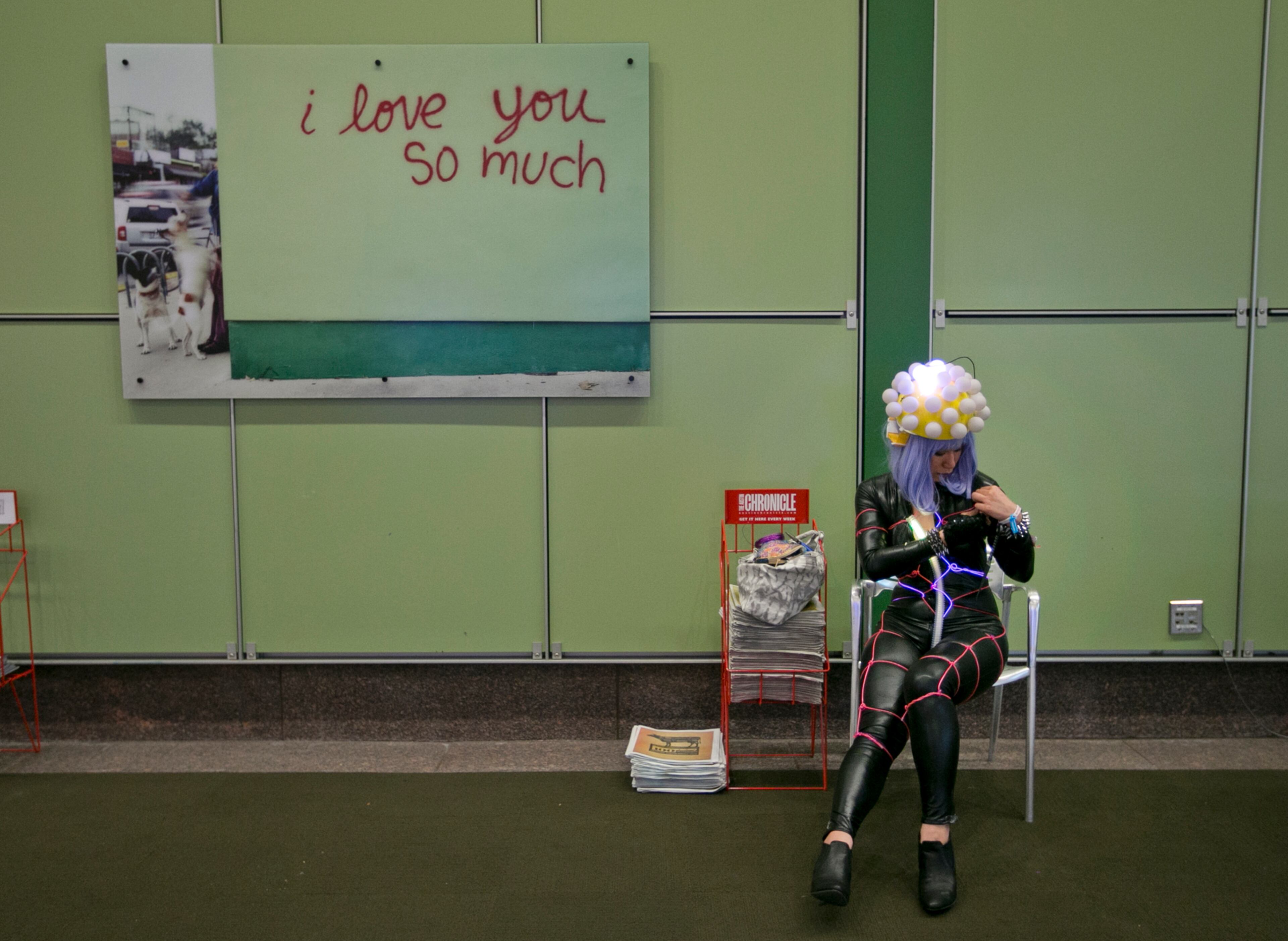 Performer Shoko Kimura adjusts her costume during SXSW at the Austin Convention Center on Sunday, March 15, 2015. Kimura, from Toyko, Japan, is planning on performing in the streets as her character Aniie. DEBORAH CANNON / AMERICAN-STATESMAN