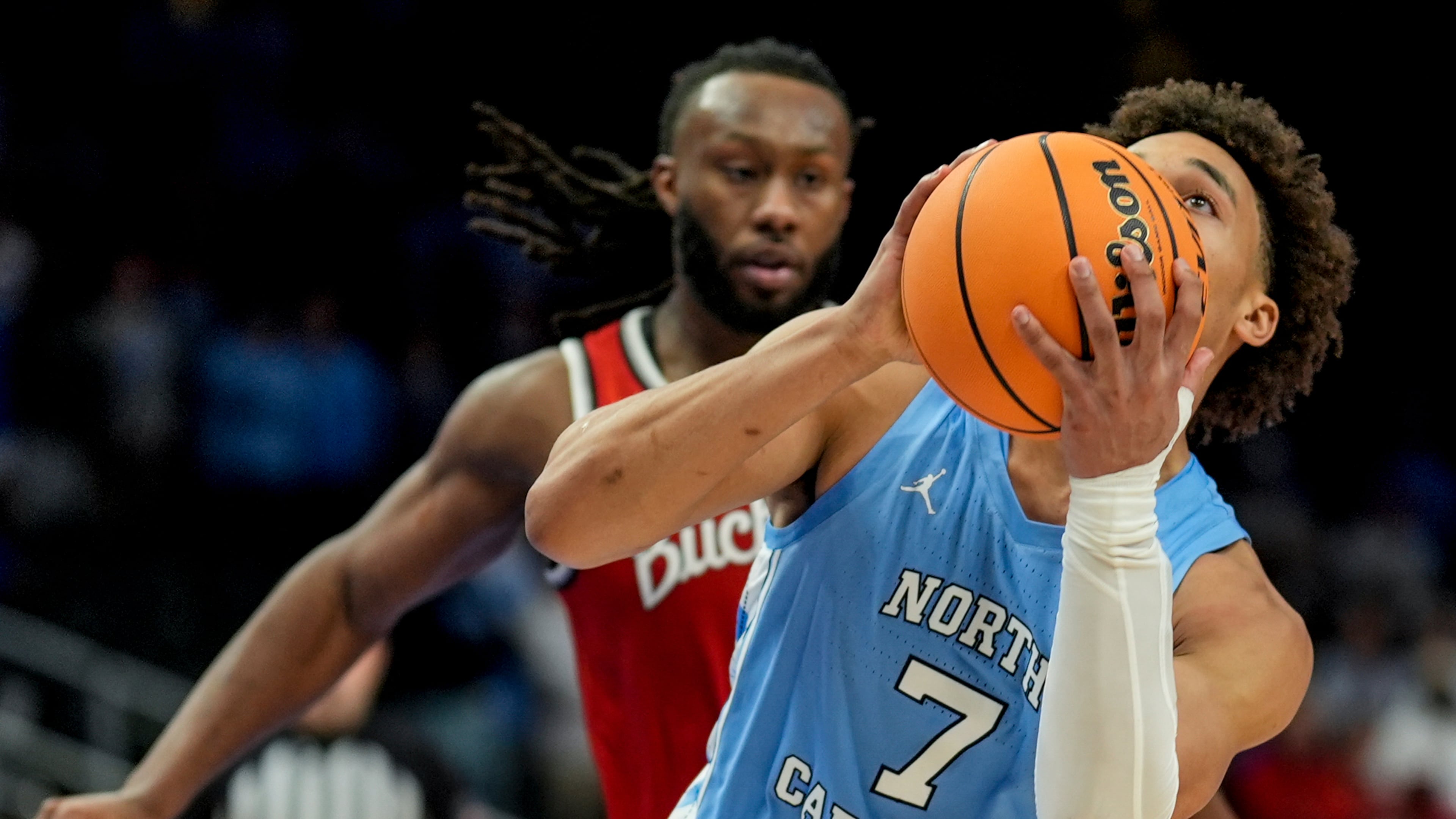 North Carolina guard Seth Trimble (7) shoots against Ohio State during the second half of an NCAA basketball game, Saturday, Dec. 20, 2025, in Atlanta. (AP Photo/Mike Stewart)