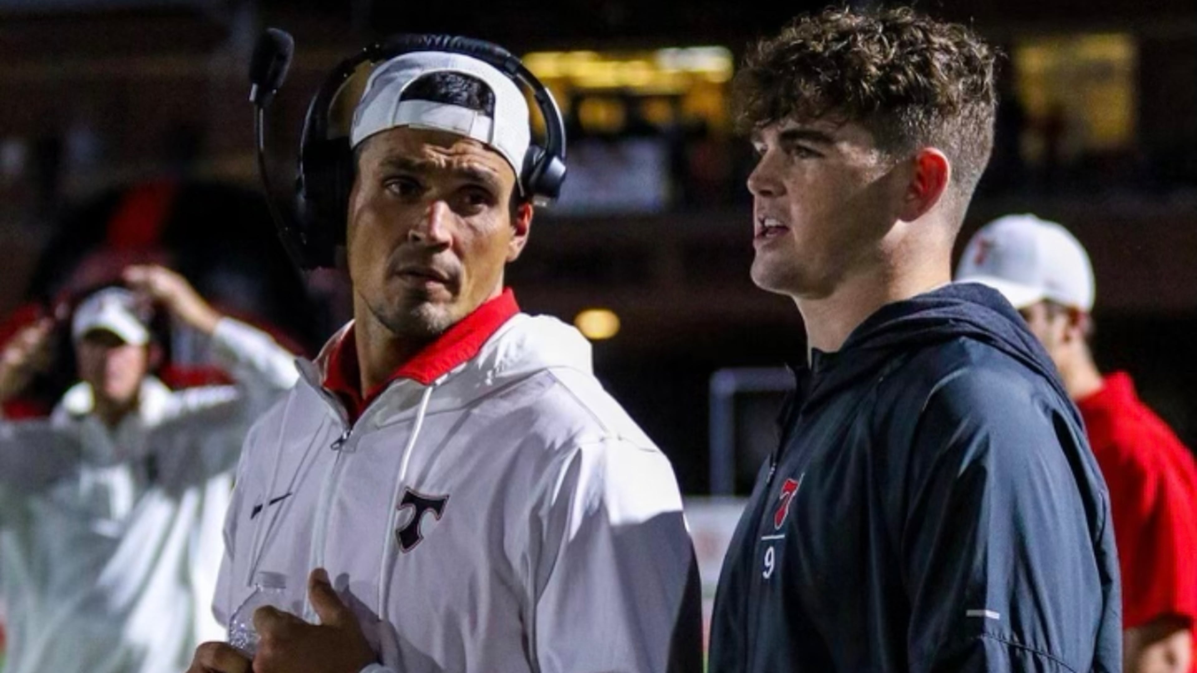 David Pollack, left, here with North Oconee High football player and Army commit Jack Kelly, will be coaching the Titans' defensive linemen in a Class 4A playoff game Saturday afternoon instead of sitting on the set with the ESPN "College GameDay" crew as he did the previous 11 years. Pollack's contract with ESPN was not renewed this in a massive talent layoff. But he has kept close tabs on his Georgia Bulldogs and the college football landscape during his hiatus this year. (Special Photo)