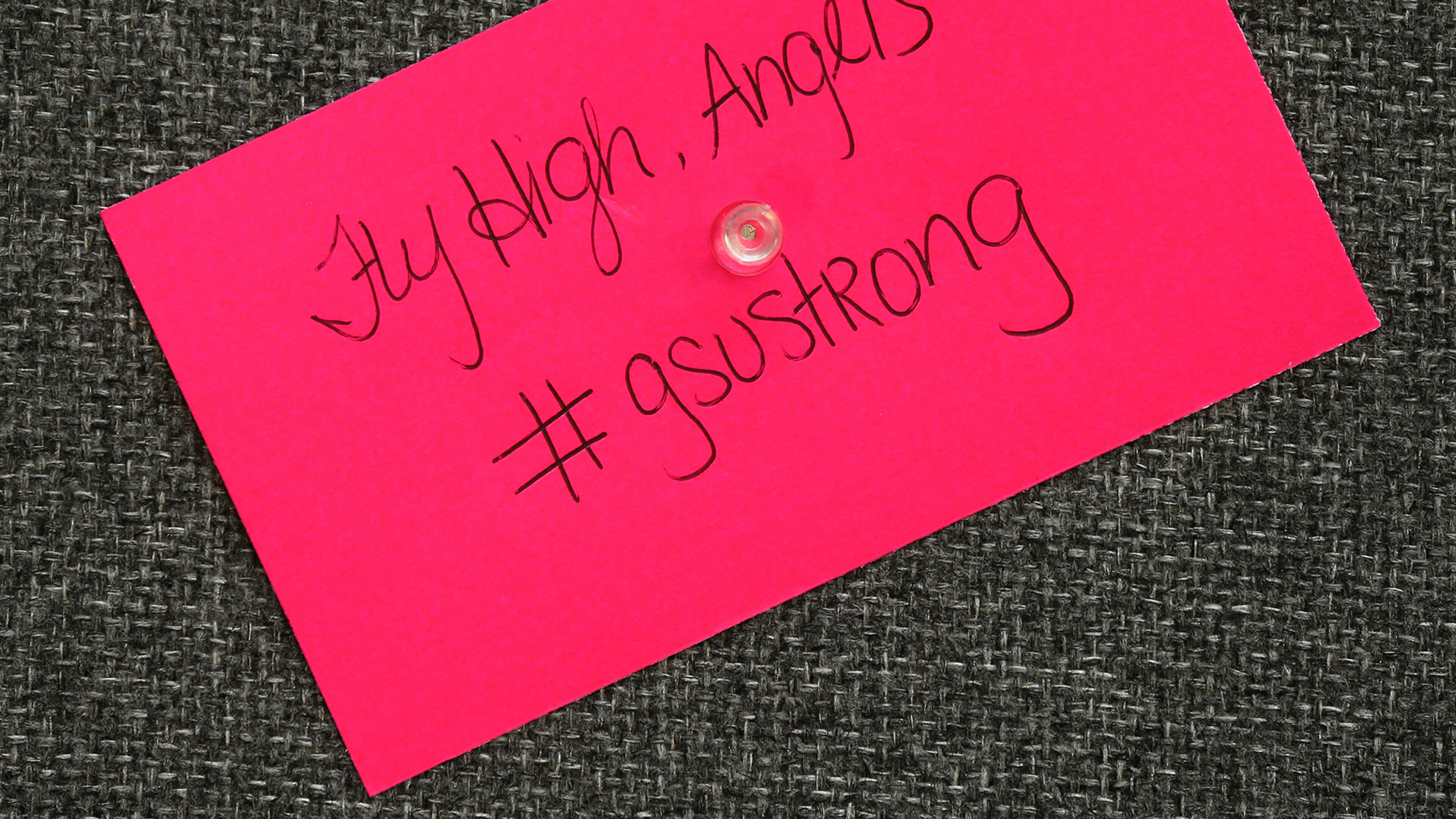 A note written by a student is posted on the "Memory Wall" for five nursing students who died April 22, 2015, in Statesboro. Curtis Compton / ccompton@ajc.com