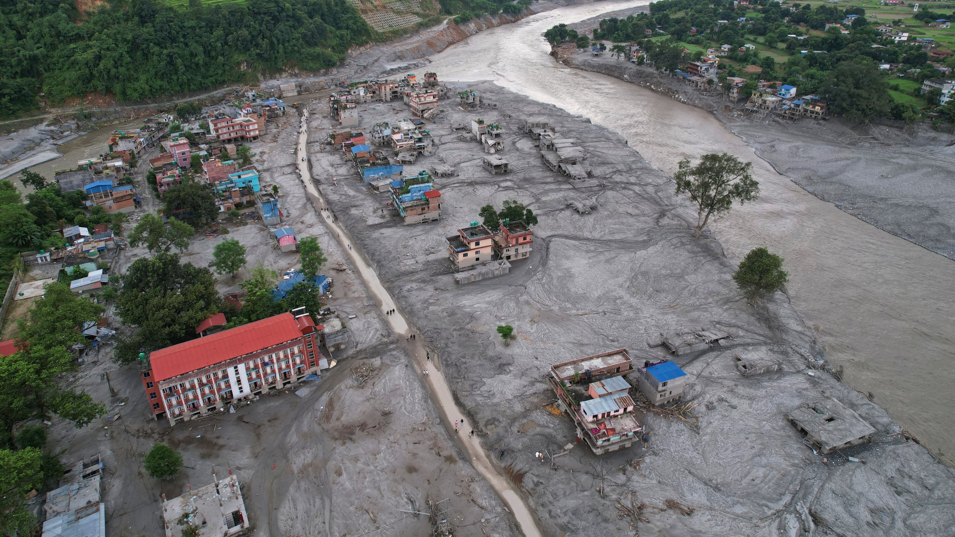 FILE - Homes are engulfed in mud in the aftermath of flash flooding along the Trishuli River in the Devighat area of Nuwakot district, Nepal, Aug. 29, 2026. (AP Photo/Rajesh Kumar Singh, File)