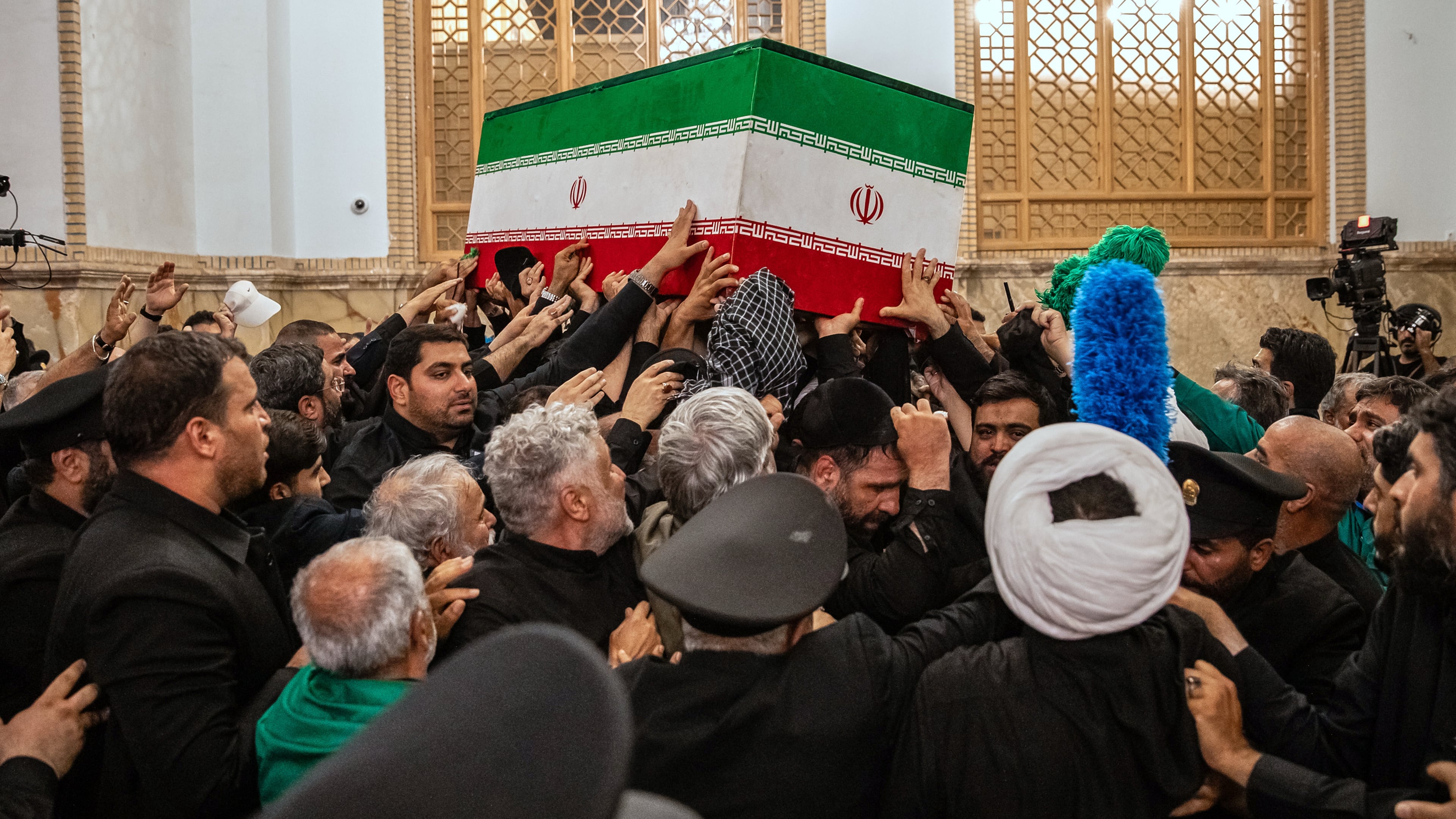 In this photo released by Iran's Supreme Leader's office, mourners carry the coffin of the late Iranian Supreme Leader Ayatollah Ali Khamenei above the crowd for the final prayer before his burial at the Imam Reza Shrine in Mashhad, northeastern Iran, Thursday, July 9, 2026. (Office of the Iranian Supreme Leader via AP)
