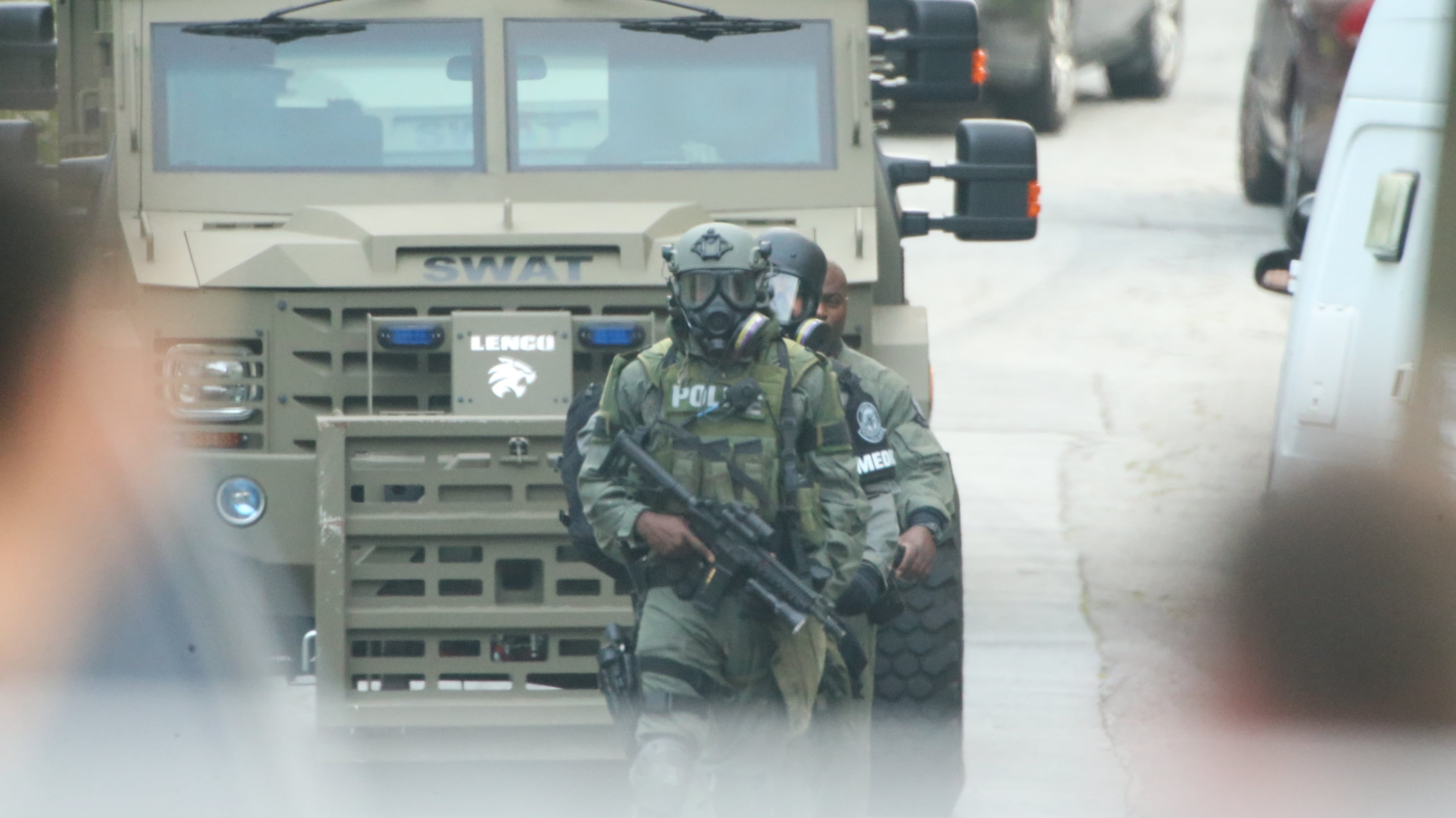 Atlanta police surrounded a home in southwest Atlanta for several hours early today, but when SWAT officers went into the house, the person whey were looking for was not there. JOHN SPINK/JOHNSPINK@AJC.COM