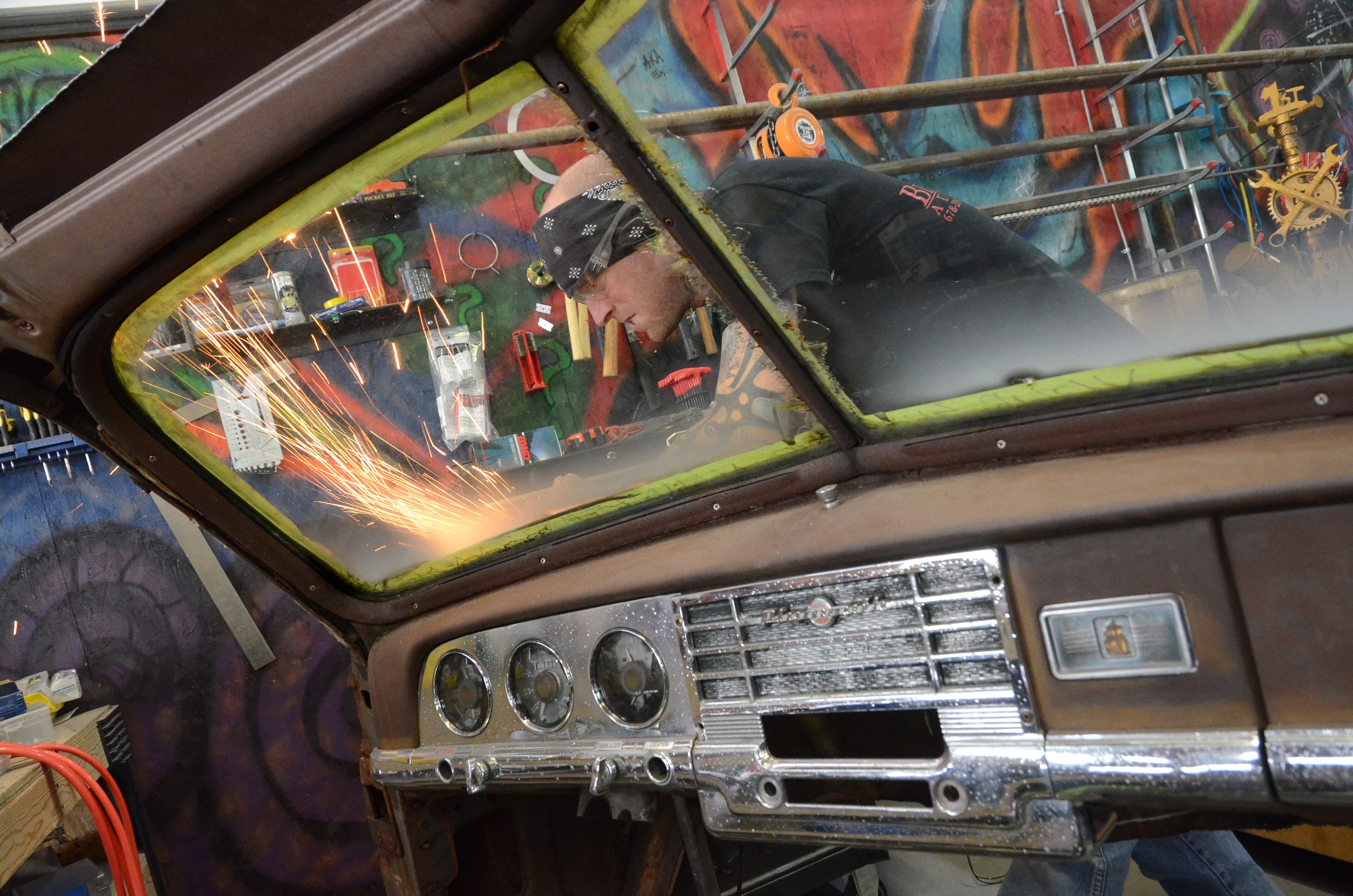 Ferguson works on a 1950 Plymouth desk.