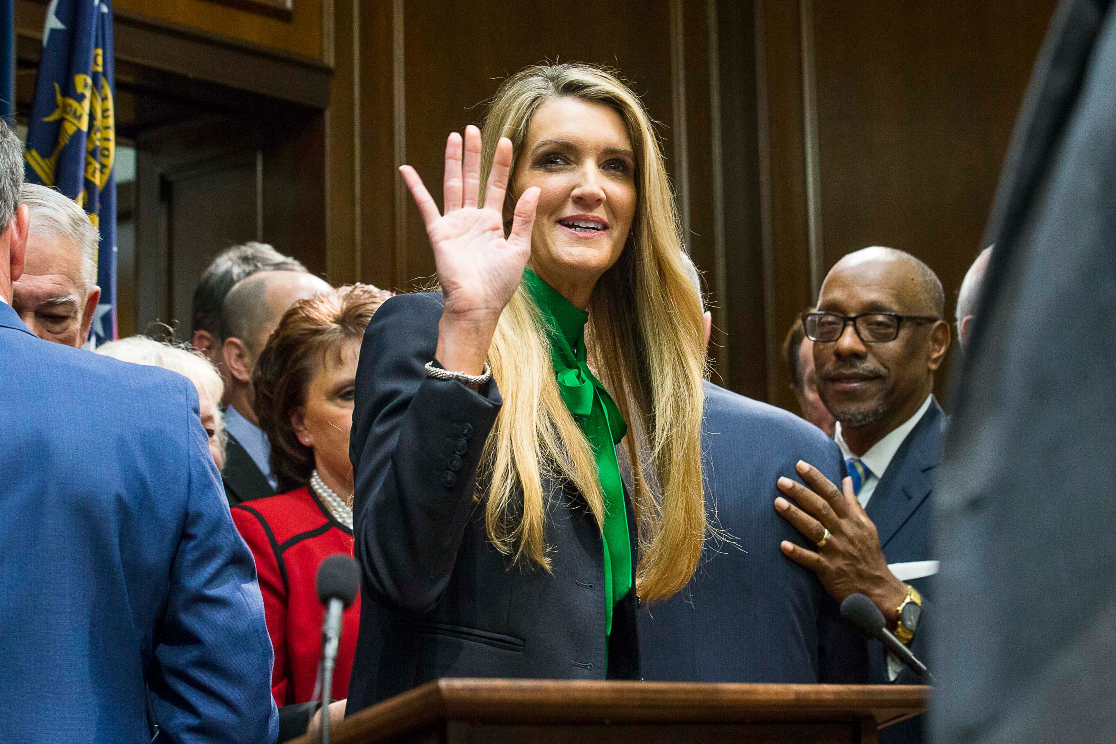 12/04/2019 -- Atlanta, Georgia -- Newly appointed U.S. Senator Kelly Loeffler waves toward supporters following a press conference in the Governor's office at the Georgia State Capitol Building, Wednesday, December 4, 2019. Georgia Gov. Brian Kemp appointed Kelly Loeffler to the U.S. Senate to take the place of U.S. Senator Johnny Isakson, who is stepping down for health reasons. (ALYSSA POINTER/ALYSSA.POINTER@AJC.COM)