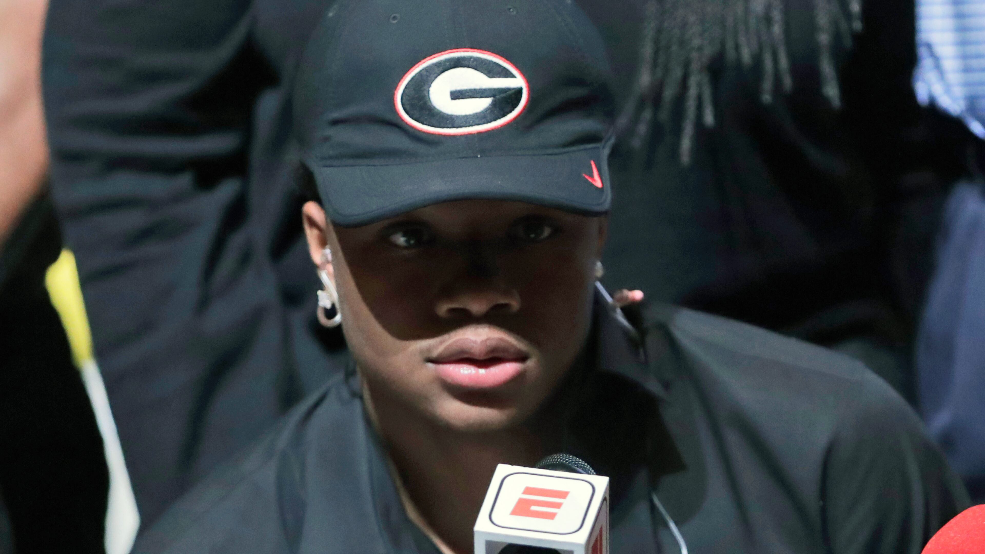 Tyson Campbell, a defensive back from the football team at American Heritage High School, announces he is signing with Georgia on national signing day, Wednesday, Feb. 7, 2018, in Plantation, Fla. (AP Photo/Lynne Sladky)