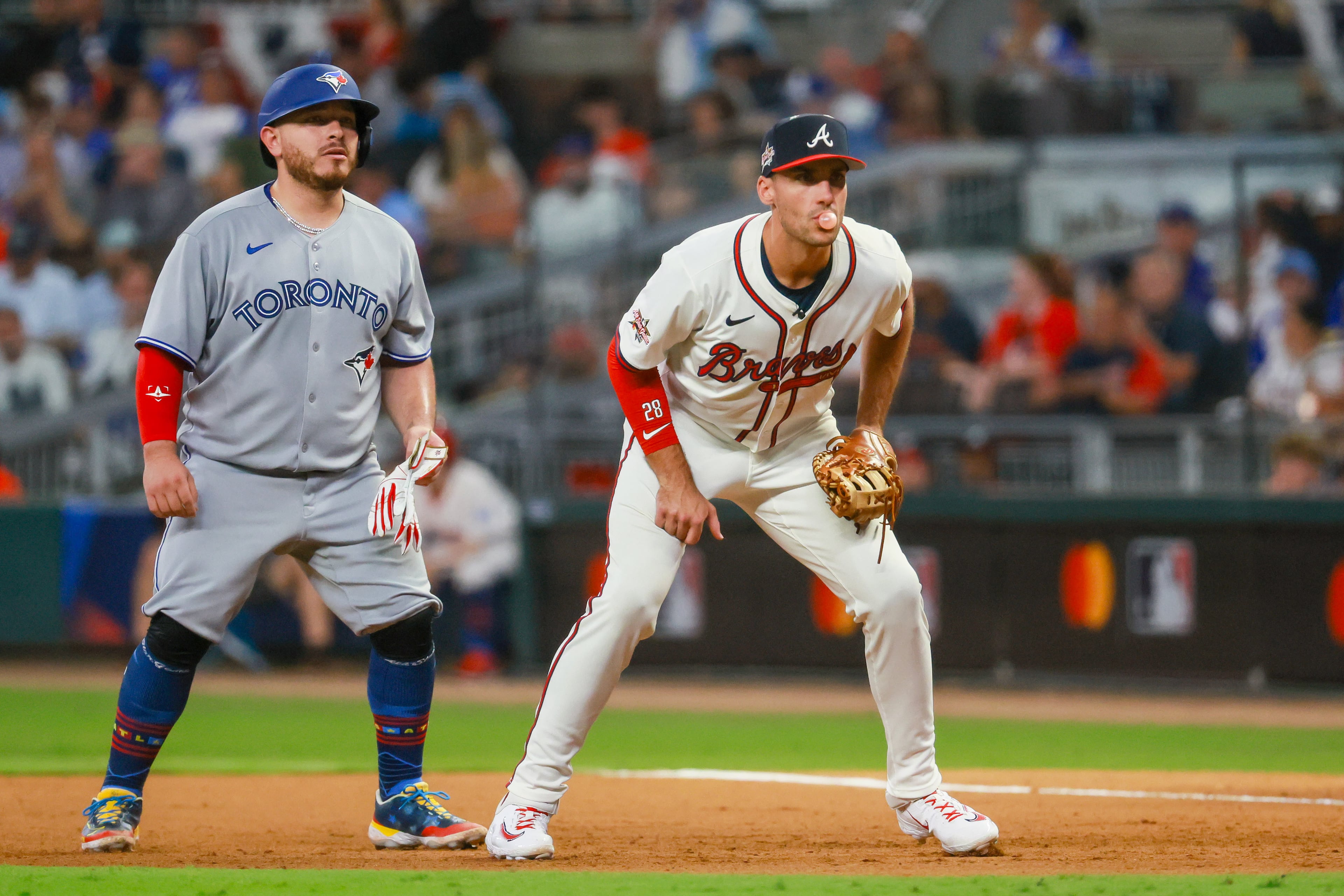 The National League's Matt Olson of the Atlanta Braves holds baserunner Alejandro Kirk of the Toronto Blue Jays close to first base during the seventh inning of the MLB All-Star Game at Truist Park in Atlanta on Tuesday, July 15, 2025. (Jason Getz/AJC)