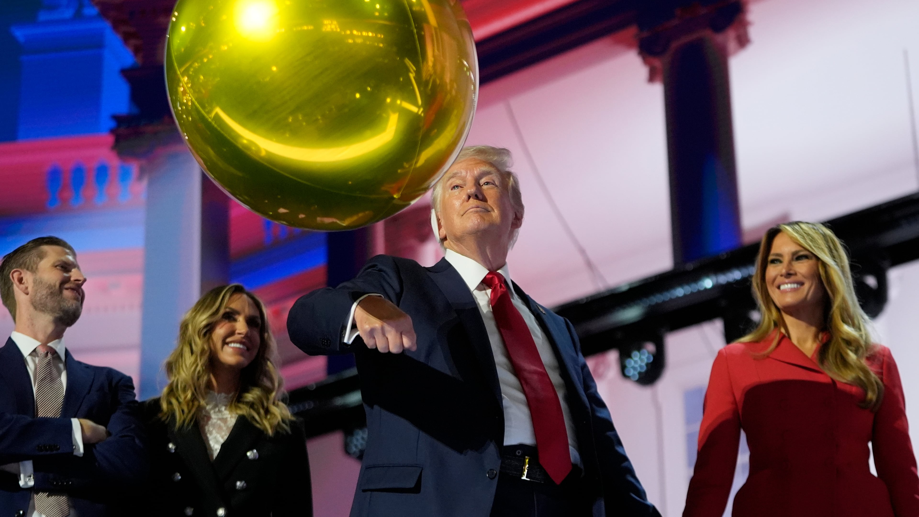 FILE - Republican presidential candidate former President Donald Trump hits a balloon during the final day of the Republican National Convention, July 18, 2024, in Milwaukee. (AP Photo/Paul Sancya, File)
