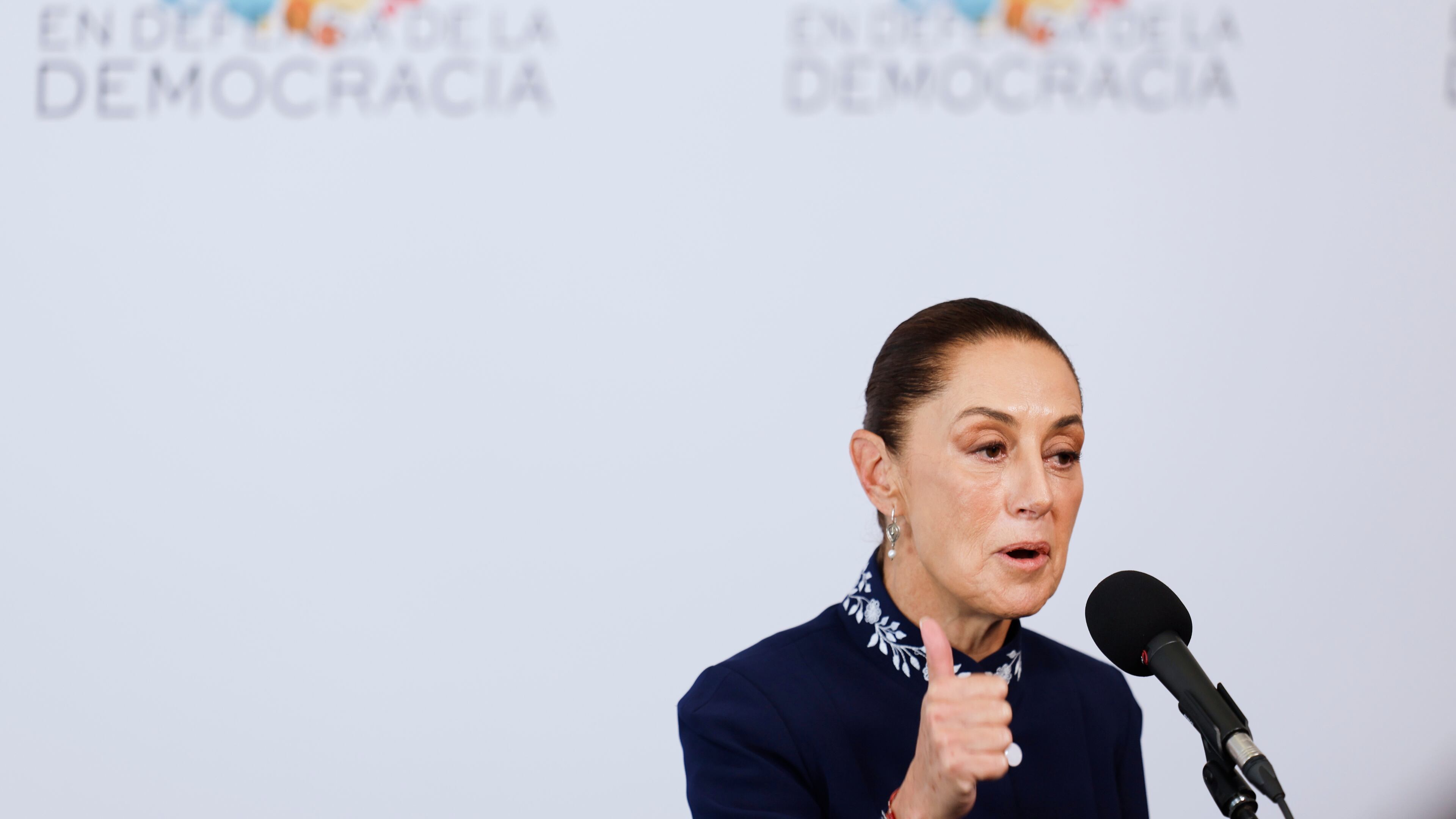Mexican President Claudia Sheinbaum addresses the media at the Meeting in Defence of Democracy summit, in Barcelona, Spain, Saturday, April 18, 2026. (AP Photo/Joan Monfort)