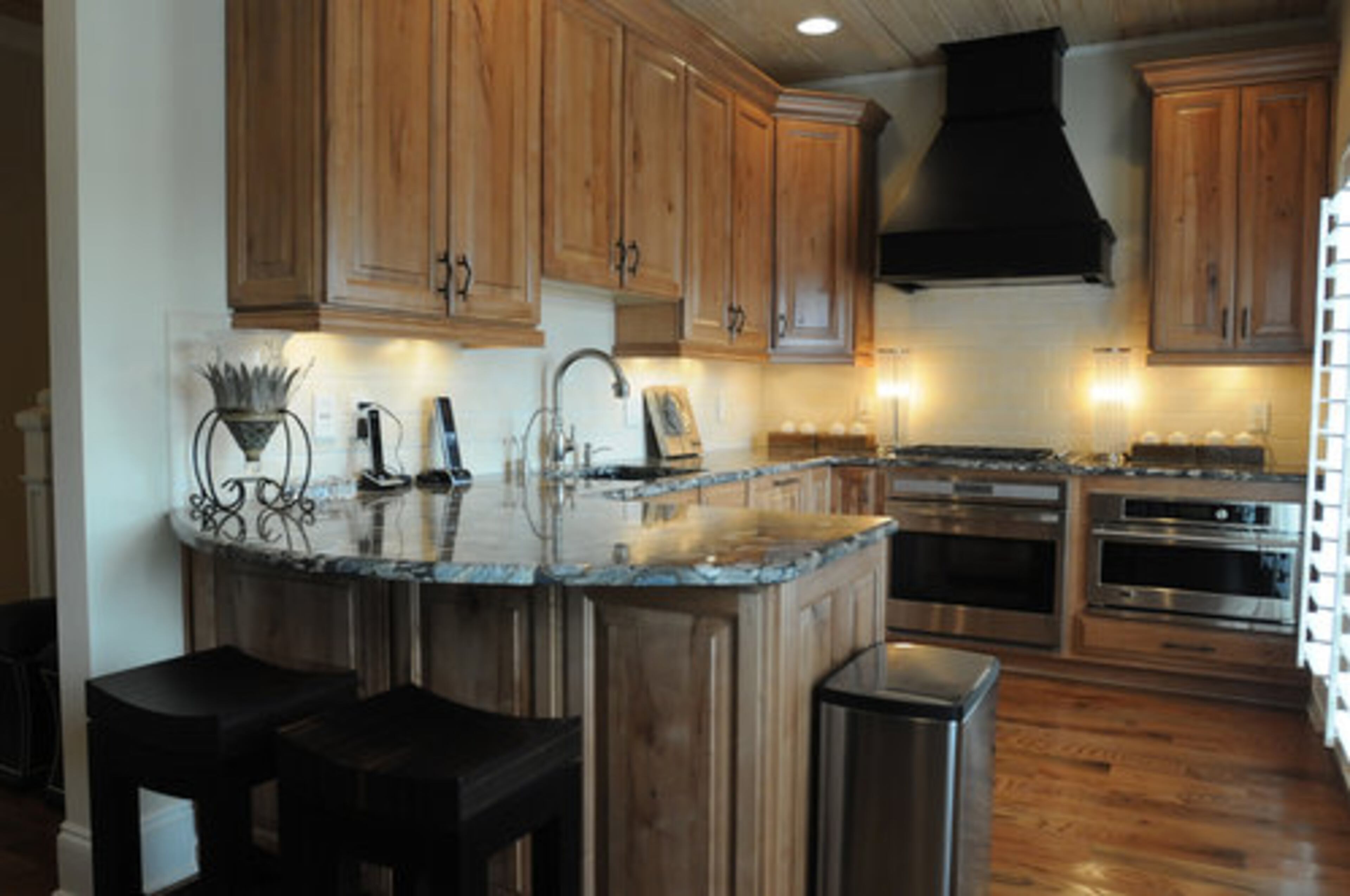 A unique granite countertop in the design of pebbles was selected for the kitchen on the top level and served as inspiration for that floor. "It was designed around the granite," Betty said. "I fell in love with the granite."