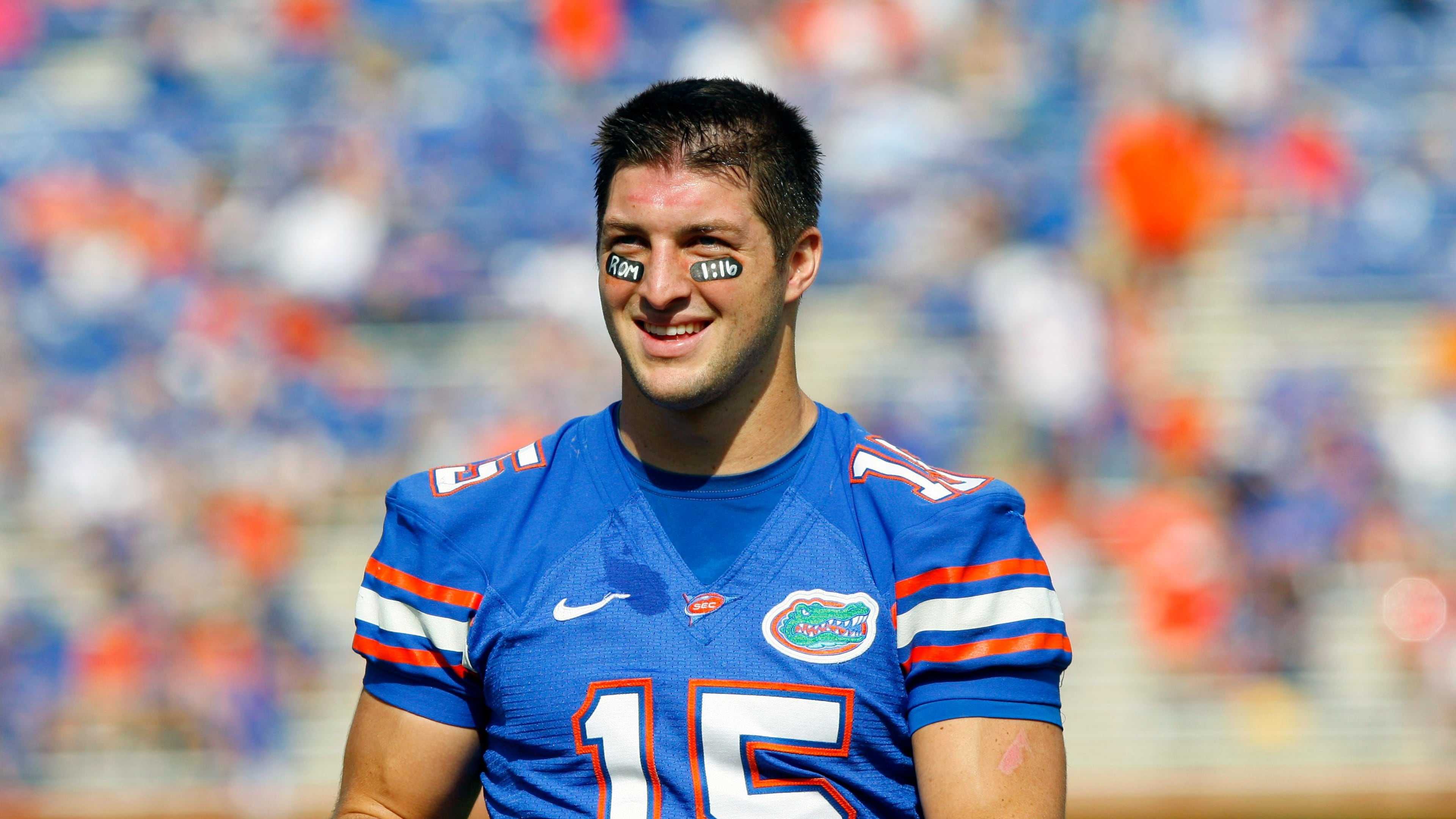 Former Florida Gators quarterback Tim Tebow smiles during warmups of a 2009 game.