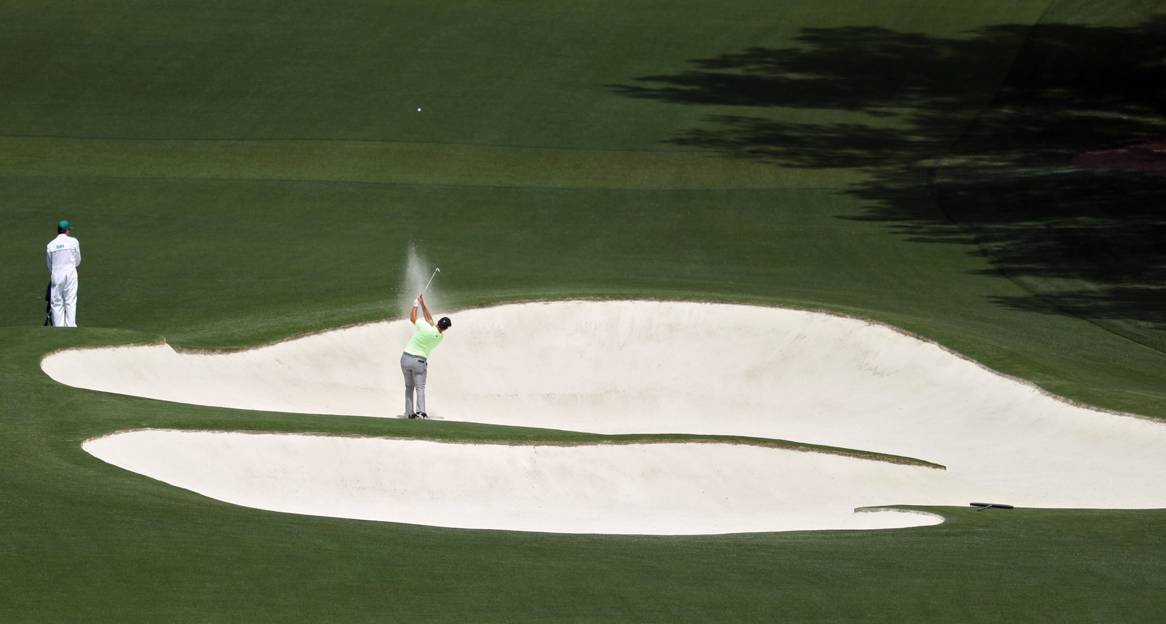 April 11, 2019 - Augusta - Joh Rahm hits from a fairway trap during the first round of the Masters Tournament Thursday, April 11, 2019, at Augusta National Golf Club in Augusta. Jason Getz / Special to the AJC