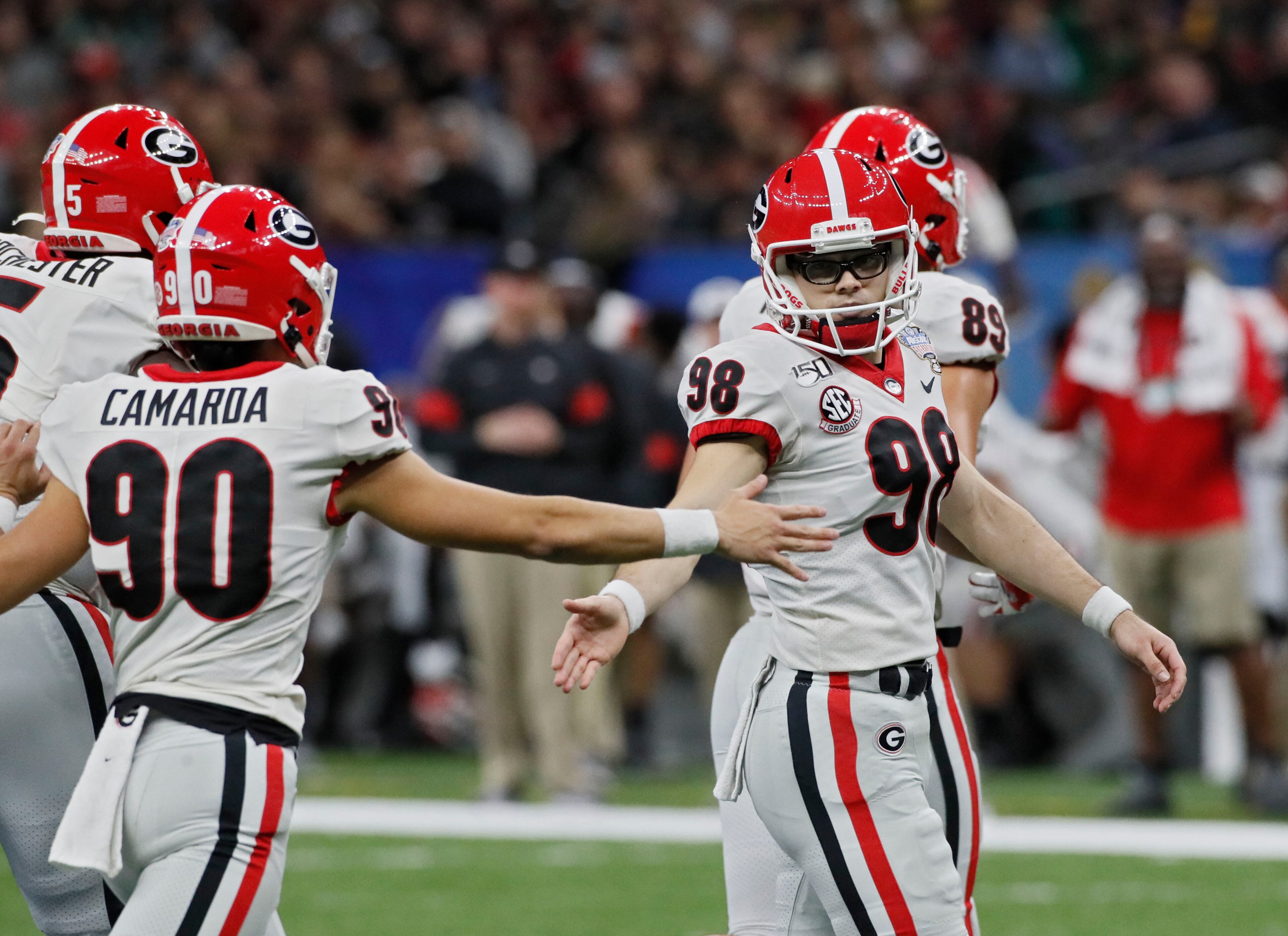 Georgia Bulldogs place kicker Rodrigo Blankenship (98) after kicking one of his two first-half field goals. Bob Andres bandres@ajc.com