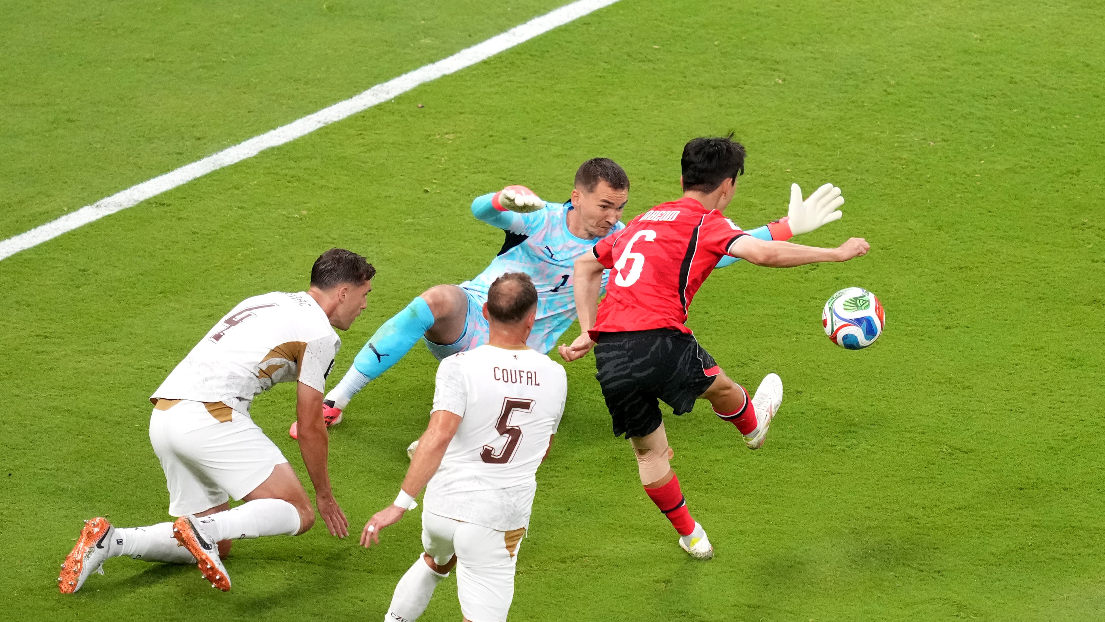 South Korea's Hwang In-beom, right, shoots and scores a goal against Czechia goalkeeper Matej Kovar during the World Cup Group A soccer match between South Korea and Czechia in Zapopan, near Guadalajara, Mexico, Thursday, June 11, 2026. (AP Photo/Moises Castillo)