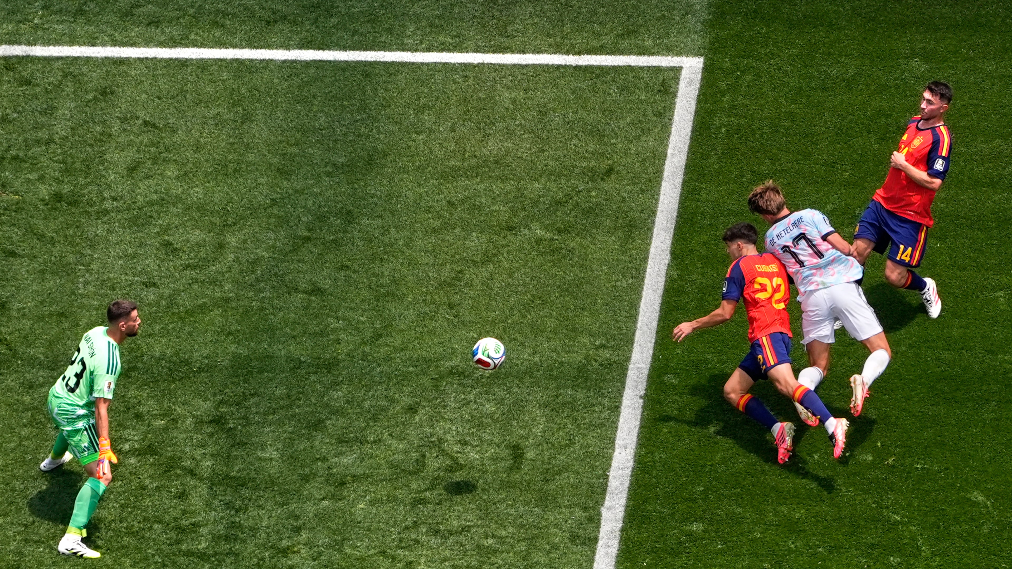 Belgium's Charles De Ketelaere (17) scores their opening goal past Spain goalkeeper Unai Simon (23) during the World Cup quarterfinal soccer match between Spain and Belgium in Inglewood, Calif., near Los Angeles, Friday, July 10, 2026. (AP Photo/Mark J. Terrill)