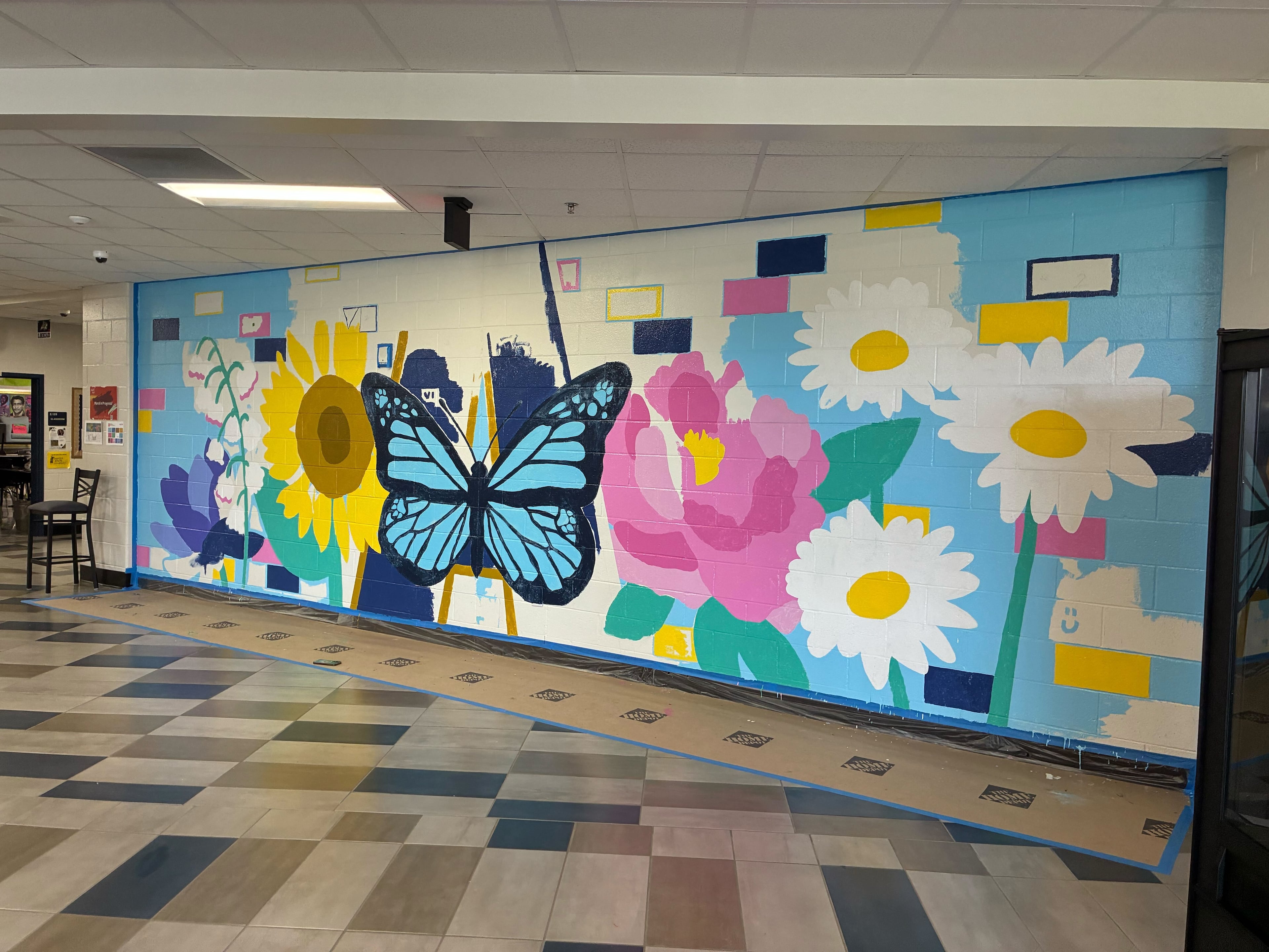 A butterfly is central to the design of a new mural at Apalachee High School. The symbols incorporated in the mural were determined by conversations with students, parents and faculty. (Courtesy of Paint Love)