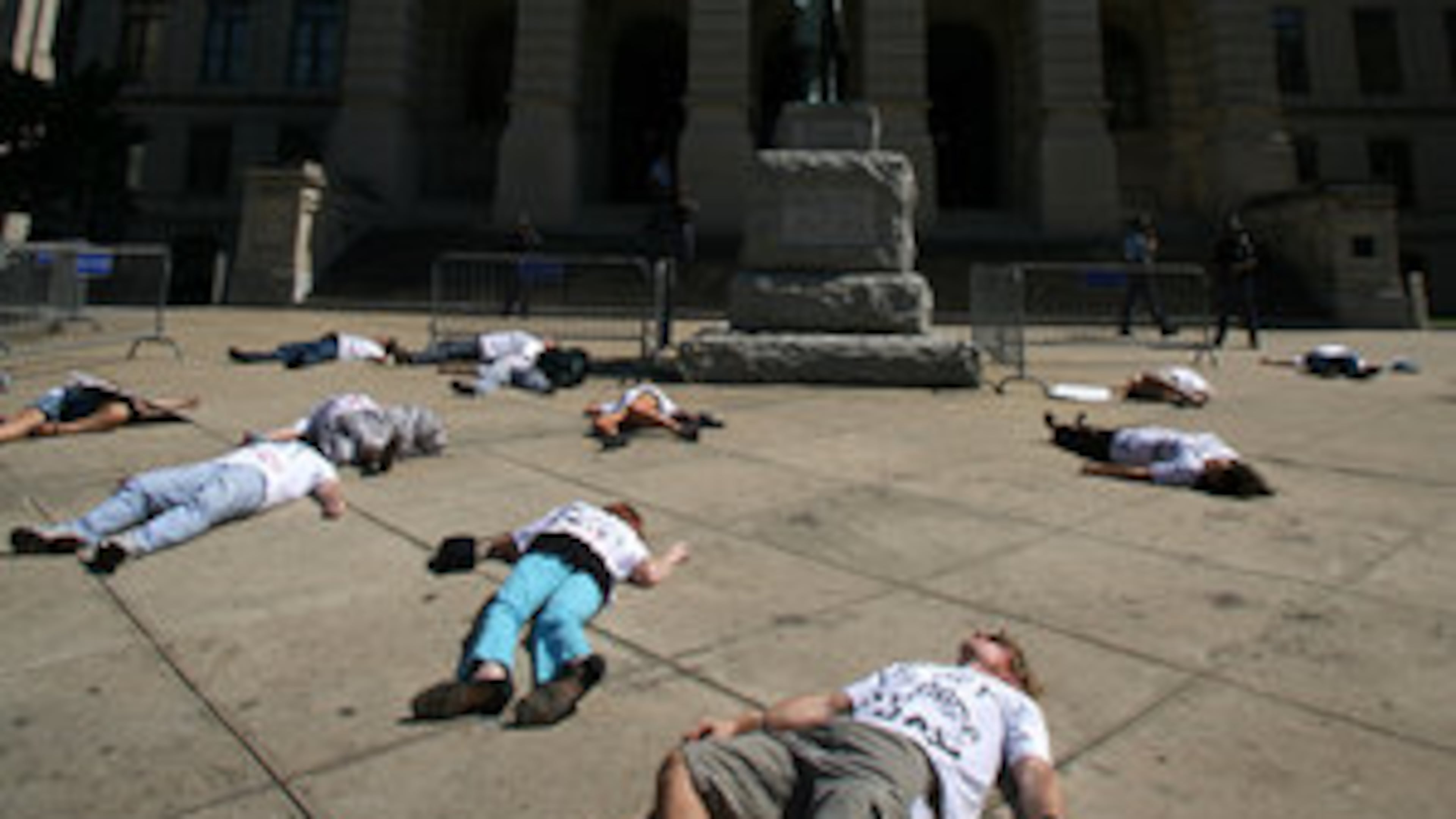 Approximately 17 Georgians in front of the Georgia State Capitol stage a "Die-In" in 2008 to show opposition to Troy Davis being executed. Davis, who was convicted of murdering a Savannah police officer, was executed in 2011. (Jessica McGowan/AJC)