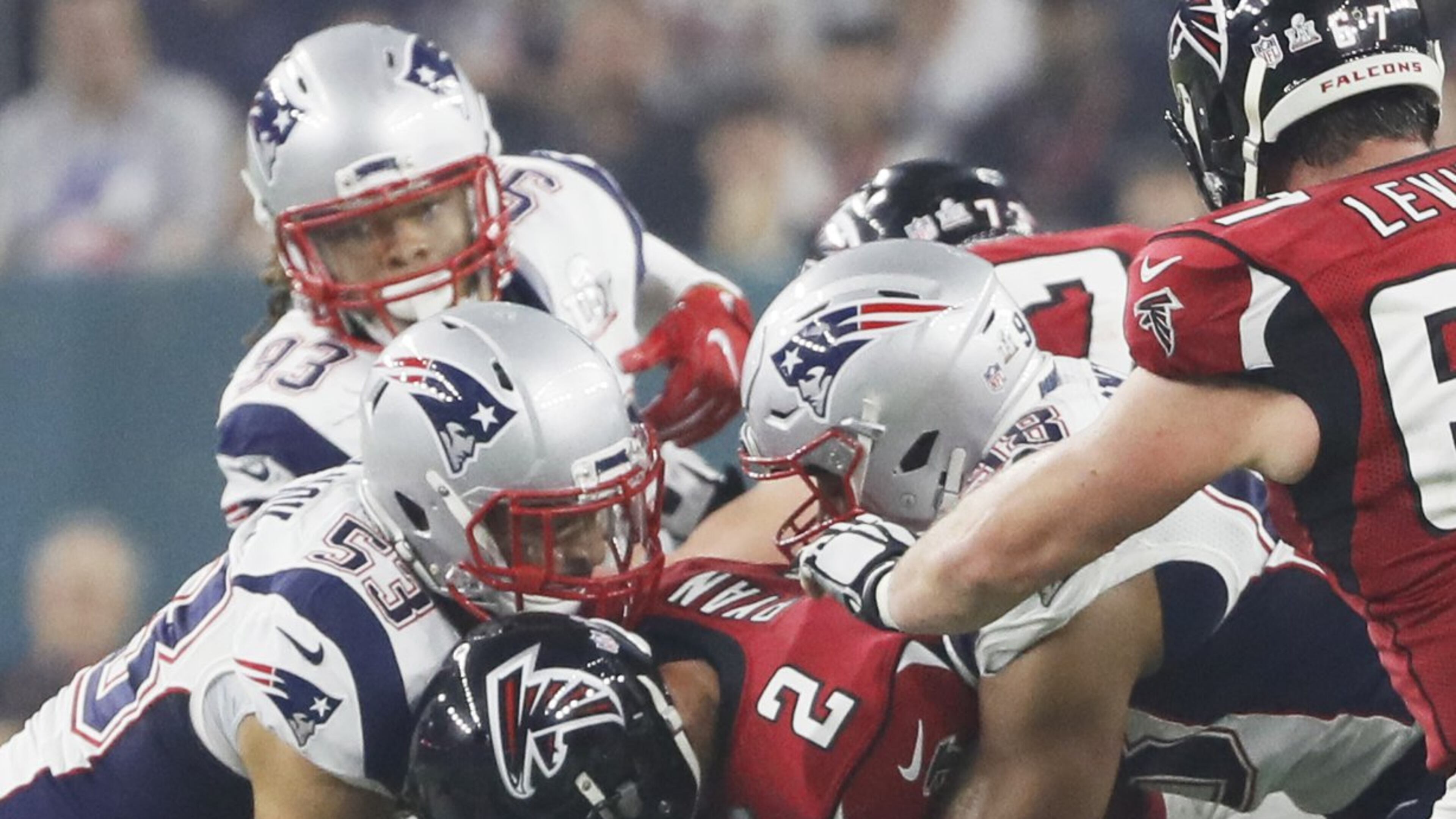 Atlanta Falcons quarterback Matt Ryan gets buried beneath New Englang rush Sunday. (Bob Andres/AJC)